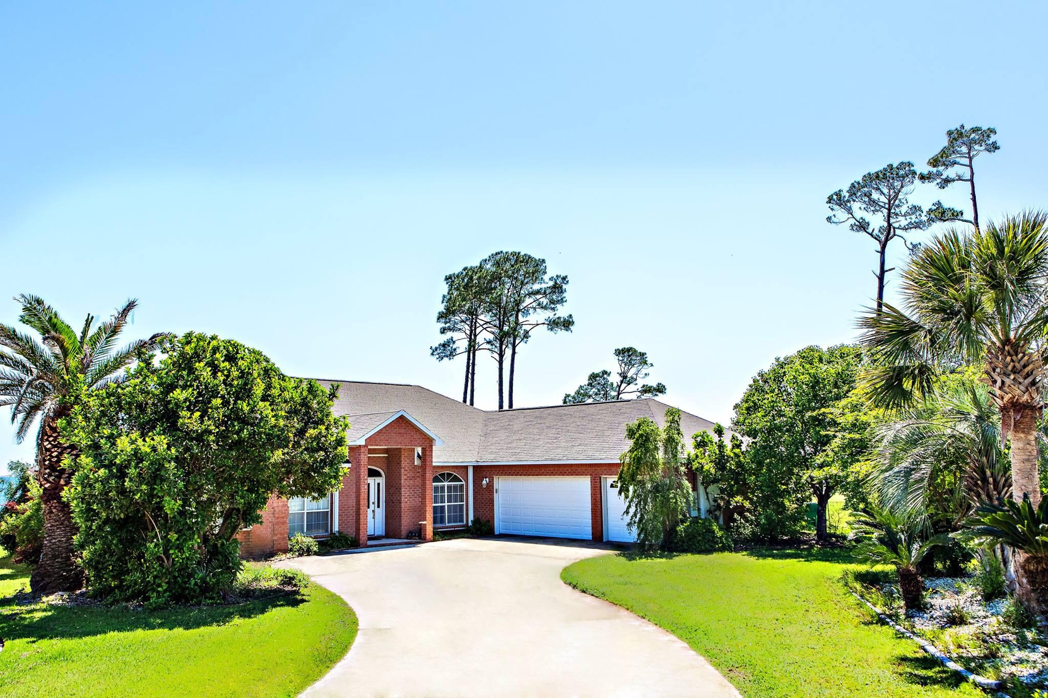 JUST REDUCED!! A WATERFRONT property with a LARGE BACKYARD and a 3 CAR GARAGE!! This very spacious, ALL BRICK, house is the perfect place to call home! This 4bed/3bath house sits on a .57 acre lot in a VERY nice neighborhood. Marble floor foyer leads into a very spacious family room with views straight to the water! French doors lead out to an open deck and the back yard. Kitchen is very spacious with GRANITE counter tops and a breakfast bar! Master bedroom also has french doors leading to the backyard. Master bathroom has TWO WALK IN CLOSETS! Sellers are MOTIVATED!