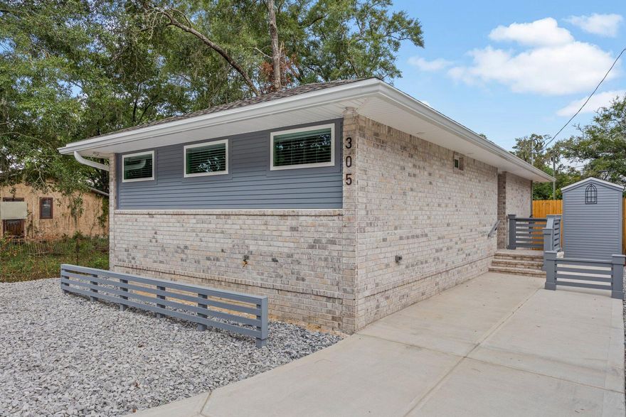 No detail was spared in this beautiful coastal modern inspired build. This 2bd/2ba home is emphasized with LVP floors, soft close cabinets and drawers, touch screen oven control, space saving pocket doors, rain shower bathroom fixture, recessed and flush mount lighting creating an open and inviting space. The stately accents bring custom home vibes with textured wall borders, crown molding, counter to ceiling kitchen tile, elevated outlets for hidden cord entertainment, built in laundry shelves, laundry cabinets, and a stainless-steel folding table. Custom built banisters and brick steps meet you as you exit into the very private courtyard boasting an expansive privacy fence with touches of garden rock to compliment the space and a solid shed that matches the house in style and color for additional storage. Best of all...it's a short walk to Niceville's waterfront park & highly popular restaurants/bars. Don't miss the opportunity to live in style with the benefit of privacy. Call today to schedule a showing!