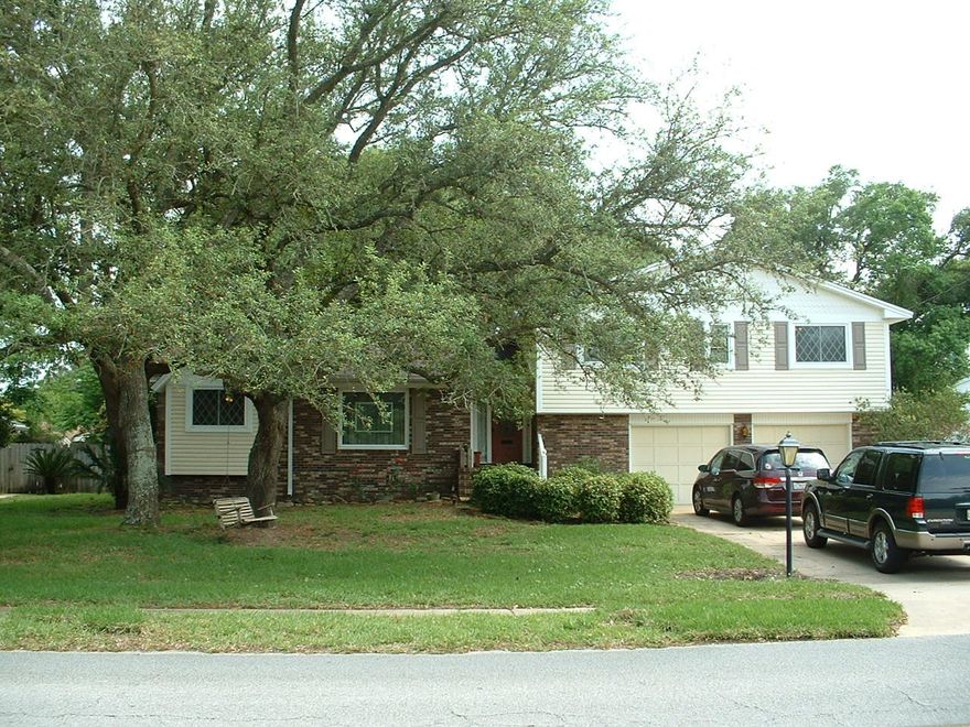 PRICE REDUCED!!! Beautiful home on scenic Yacht Club Drive. If you are looking for a home with a large yard and room to grow, you don't have to look any further. This home has been lovingly cared for and features 4 large bedrooms and 2 baths. All the bedrooms are upstairs. The first floor is the living area with a formal living/dining room combination, nice eat-in kitchen with stainless steel appliances and a large den with custom built-in cabinetry and a fireplace. The yard is large with mature trees that give you lots of shade to relax on the deck or swing on your choice of two swings. Down stairs is a bonus room which is currently being used as a craft room. This home also features a NEW HVAC system and tankless hot water heater. Also, NEW COPPER WIRING!!