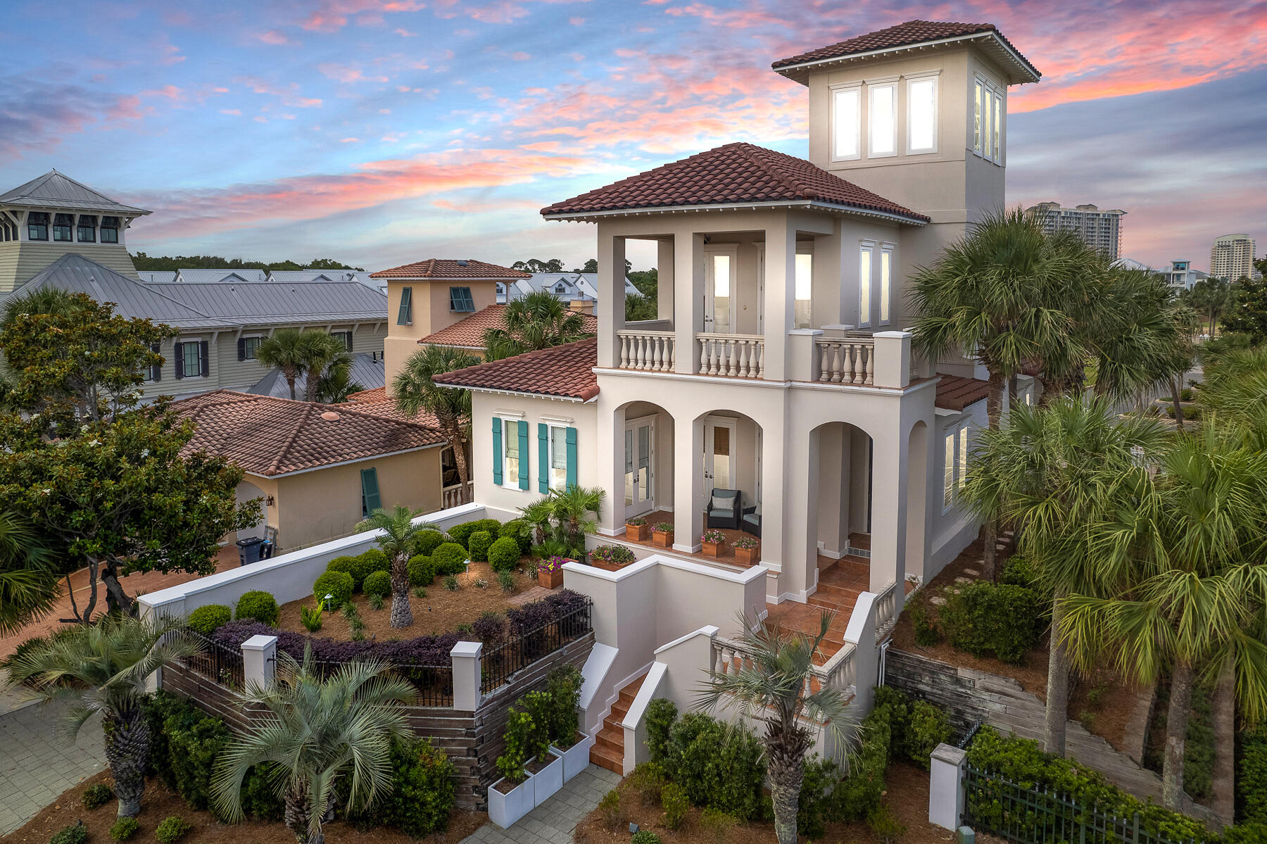 No detail was overlooked in this expanded, meticulously remodeled and structurally enhanced mediterranean style home. Located on the third tier in exclusive gulf-front Caribe, this furnished retreat boasts prime access to the gulf with the allure of a private escape. Step onto the boardwalk from the back porch to access the low-density, snow-white beach deeded for neighborhood residents.Inside the main house, three spacious bedrooms all with en suite baths and a luxurious master suite invite effortless relaxation. A third floor enclosed lookout level offers 360 degree views of the breathtaking horizon through 12 Jeld-Wen Atlantic Coastal windows.  The well-equipped kitchen has open shelving, a gas cooktop, and a wine refrigerator. Guests enjoy a rare, separate casita equipped with a full