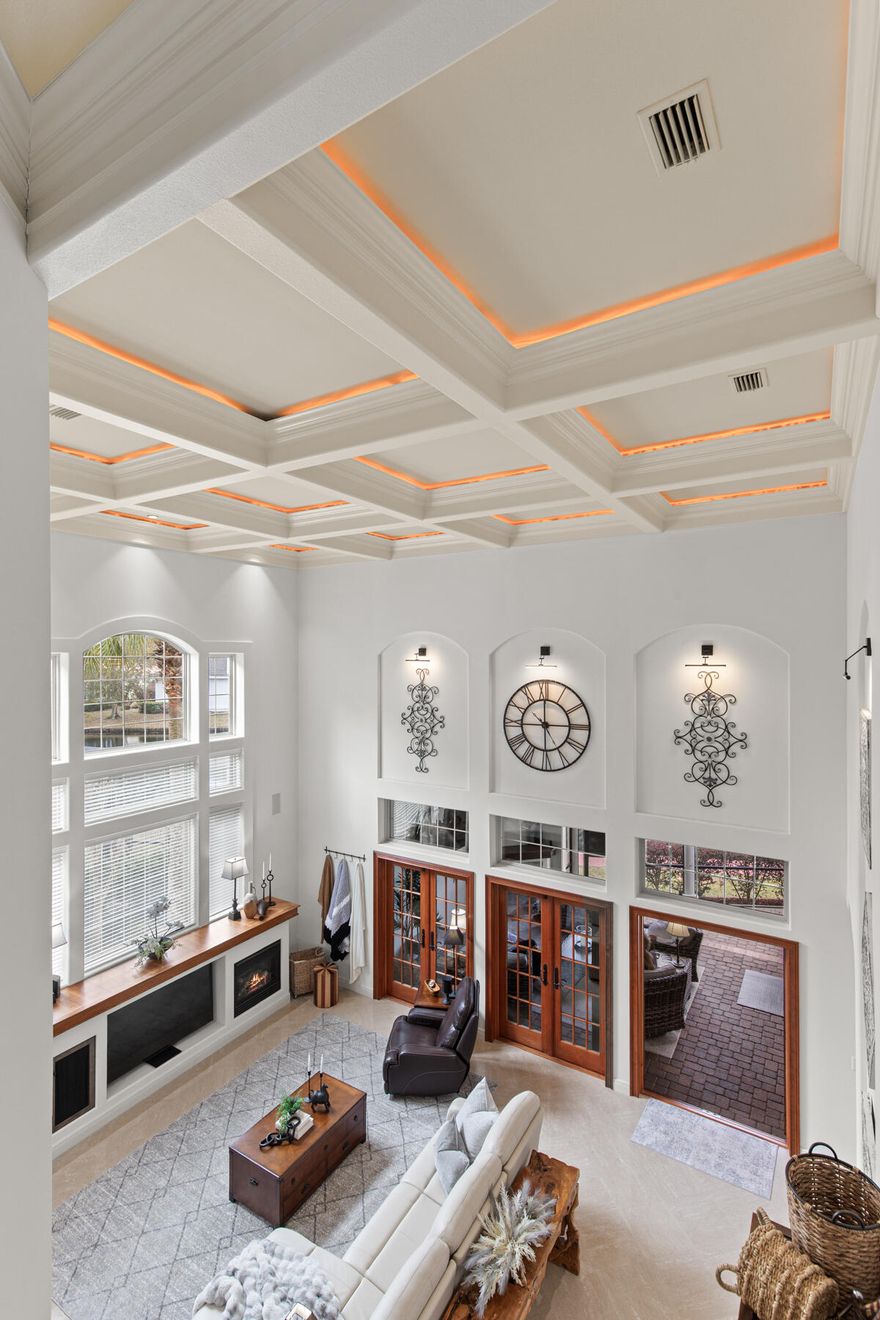 Simply Magnificent!! OMG... you have got to see this one! This is the one with a Soaring 23 Foot detailed Wood Ceiling that greets you with its Open Living concept connecting to a knockout Lanai complete with summer kitchen, a pecky cypress ceiling, gas grill, fireplace, and an outdoor T.V. There's more...with the paver deck having an easy to care for spool (Small Pool) and an awesome conversation vestibule. This is the one that renowned builder Alex Koskey considered to be his ''Crown Jewel'' with a multitude of well thought out fine finishes, Four- and one-halfbathrooms, a beautiful first floor office and primary on-suite. It is meticulously kept and the current owners have spent over $241,000 on current upgrades. Come see it today, make it yours and you will love it forever!