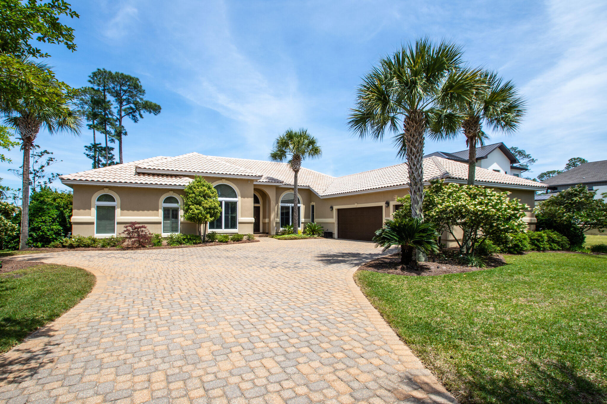 Beautiful Bay front, three bedroom, ,four bath home situated on one level on .6 of an acre with 100 feet of Bay frontage. The home features an open kitchen/family room floor plan perfect for entertaining with high end Wolf and Sob Zero appliances. There are wood floors and plantation shutters throughout. Enjoy the screened-in heated pool and spa or hours of fun boating from your own private dock with boat lift. There is a full house back-up generator, central vacuum system and security system with external cameras. Split bedroom plan with separate living and dining rooms and a large office. Spacious three car garage with ample driveway parking.