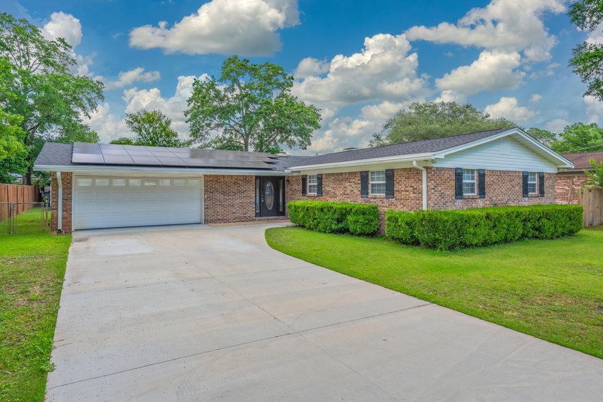 Welcome to this charming all-brick single-family home featuring luxury vinyl plank flooring, a brick wood-burning fireplace and a fully updated kitchen with stone countertops, stainless steel appliances and upgraded cabinetry. The spacious master suite offers a custom walk-in shower and two wardrobe closets. The home also features 3 large guest bedrooms and a generously sized guest bath with a dual vanity and tile surround bath/shower combo. Enjoy the convenience of an included washer and dryer, a large fenced-in backyard--perfect for outdoor living--and a cooled two car garage for year-round comfort. Monthly electric/solar fee applies. Move-in ready and full of style! Don't miss out on the opportunity to rent this PRIME rental home...contact us today for a showing!!