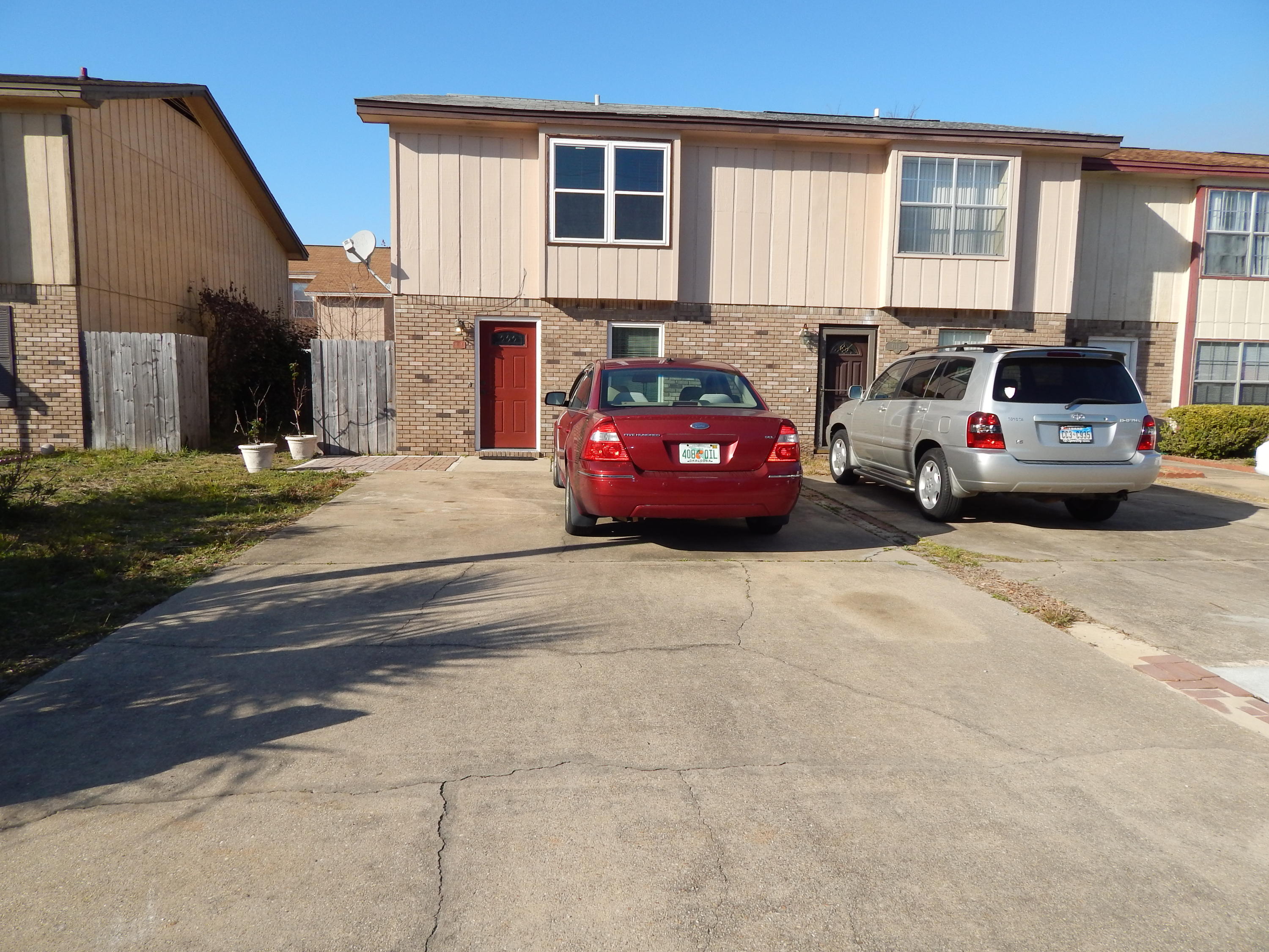 MOVE IN READY! END UNIT TOWNHOME WITH ALL NEW WINDOWS! Updated Designer tile, Brand New Carpet, New Disposal, Newer fixtures, Faucets, Lights, Freshly Painted inside and out! Open Living Room with Dining Room and Open Kitchen with Breakfast Bar. All appliances are newer and in good condition! There is a half bath downstairs for guests. Upstairs there are two large bedrooms (One has a HUGE Walk-in Closet!) and a Full Bath! Very convenient location, close to all local Military Bases, Schools and Shopping! Large inside laundry room for extra storage. Privacy fenced back yard large enough for pets and play. 8x8 Hurricane rated shed for extra storage! FOUR dedicated parking spaces and NO HOMEOWNERS ASSOCIATION! Call to see this lovely home today! A quick closing is possible!
