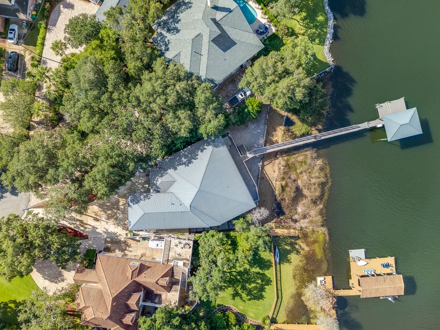 ACCEPTING BACK UP OFFERS. Welcome to your waterfront oasis in the highly sought-after Lake Lorraine community in Shalimar, Florida. This stunning home offers a serene escape with breathtaking bayou views and an abundance of luxurious features.Step inside to discover an open floor plan that seamlessly blends the interior spaces with the captivating natural beauty just outside your windows. The main living area boasts panoramic bayou views, creating a sense of tranquility and serenity throughout the home.Built in 2015, this home showcases the finest craftsmanship and attention to detail, including ICF construction for enhanced durability and energy efficiency. The fabulous office space provides the perfect backdrop for those who work from home or desire a dedicated workspace. With three spacious bedrooms and three bathrooms, there is plenty of room to accommodate your family and guests. Each room exudes a warm and inviting atmosphere, ensuring everyone feels right at home.

The exterior of this property is equally as impressive, offering over 100 feet of waterfront access. Spend your days lounging on the beautiful decks, taking in the picturesque views and enjoying the gentle breeze. For boating enthusiasts, a boat dock and boat lift and a boat garage provide convenient access to the water and private boat storage, allowing you to explore the stunning bayou or drive out to the Gulf of Mexico at your leisure.

Located in the highly desirable City of Shalimar, this home is just a stone's throw away from the prestigious Eglin Air Force Base and offers easy access to a variety of amenities. Additionally, this property is situated within a golf course community, perfect for avid golfers or those looking to enjoy the scenic beauty of the surrounding landscape.

Don't miss the opportunity to make this waterfront retreat your own. Schedule a showing today and experience the epitome of luxury living in Lake Lorraine of Shalimar, Florida.