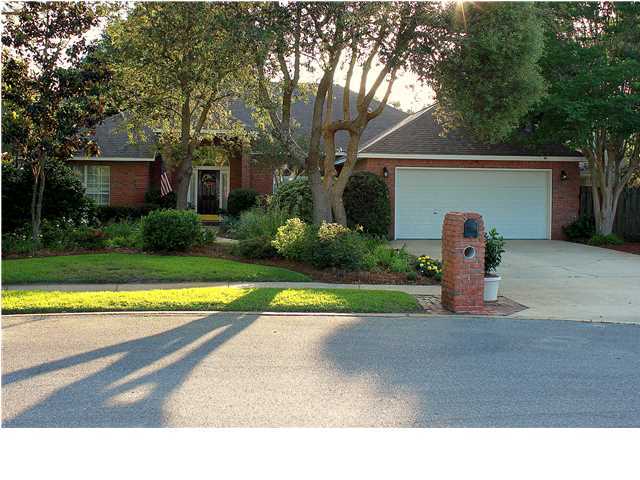 Worry less this hurricane season as the sellers offer a brand new roof at closing. This charming, one-owner home is in pristine condition and boasts an open concept floor plan. Upon entry, you're greeted with soaring ceilings and wood floors. In 1999, a 25x20 family room was added by the original builder with recessed lighting, high ceilings, a second fireplace, French doors all around, and beautiful plantation shutters. Also added was a pool with screened enclosure that is in impeccable condition. Relax in your backyard with the gorgeous oak trees, ferns, and other lush landscaping. This home offers a split floor plan with two large bedrooms on one side of the home with a bathroom. One bedroom offers built-in bookshelves and cabinets which could be great for a child or to use as