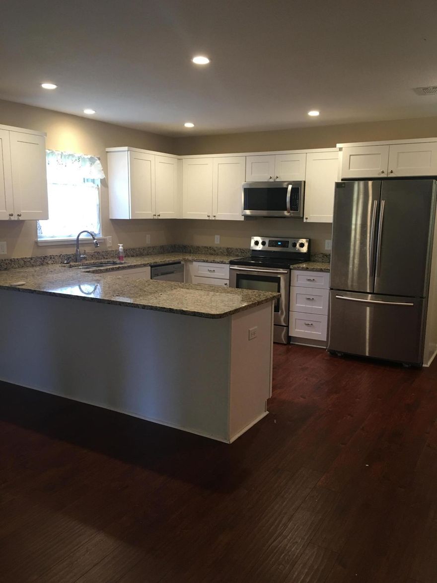 Four (4) bedrooms in the heart of Niceville! Home was renovated in 2015 with new kitchen, white shaker style cabinets, granite counter tops and stainless steel appliances. Bathrooms include porcelain tile floors and granite top vanities. Open floor plan with wood laminate floors, Large living area with a wood burning fireplace. Backyard features a covered patio with built-in outdoor grill and fenced backyard. New metal roof and windows also installed in 2015.