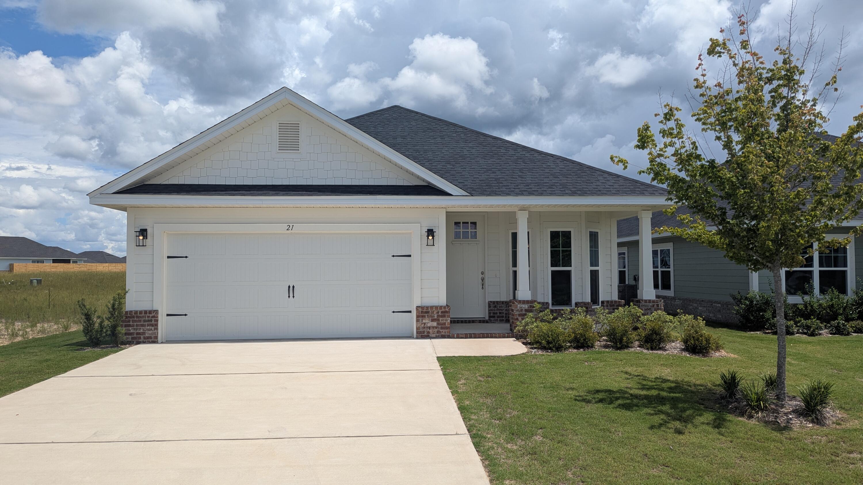 Limited time offer: 4.99% fixed rate financing (FHA or VA) + up to $10K flex money + builder pays most closing costs with a preferred lender.THE BLUFFS subdivision is located just a 20 minute drive to South Walton beaches! Craftsman style, 3 BR/2 BA home with Hardiboard siding and brick skirt. The interior features 9' ceilings throughout, and 10' trey ceilings in the Living Room and Master Bedroom. Bay window provides for a sunny dining room. 8' entry doors, quartz countertops and durable CoreTec Pro Plus luxury vinyl plank flooring throughout; no carpet. Large walk-in master closet.