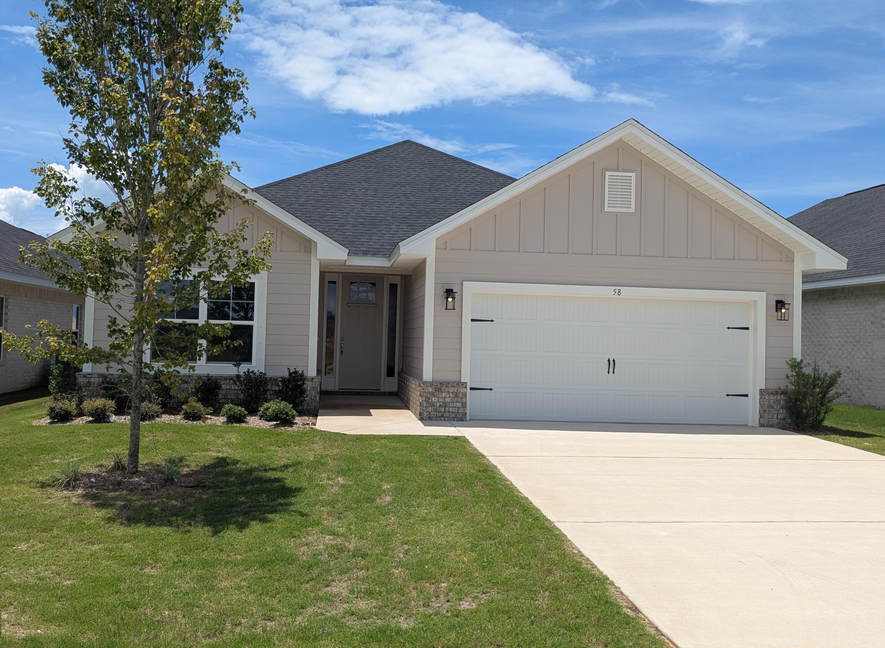 For a limited time... 4.99% fixed rate financing (FHA/VA) + up to $10K flex money + builder pays most closing costs with a preferred lender. New Craftsman style home with a brick skirt and hardiboard siding. 20 minutes to Blue Mountain Beach on the Gulf of Mexico. 3 BR / 2 BA with 2 car garage + garage door opener, cathedral ceiling, 8' entry doors, large covered rear patio 15' x 9', quartz countertops, CoreTec Pro Plus Luxury Vinyl Plank flooring throughout, no carpet. Separate garden tub + shower in Master Bath, Moen faucets, lever handled hardware, attic pull-down stairs. Fully sodded yard with sprinkler system, well and pump.