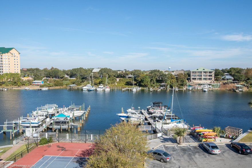 Harbor front condo with deeded beach access!!! Enjoy harbor views and close proximity to Destin's famous white sand and emerald green waters. Dolphin Point Condominium features harbor side pool, exercise room, tennis court, exterior storage for condos, dock, and lush landscaping. This 6th floor condominium boasts additional square footage, master bedroom facing harbor, large master shower with custom, tile surrounds, remodeled kitchen, granite, stainless appliances. Turn key and rental ready! Make this your family's Destination today!!