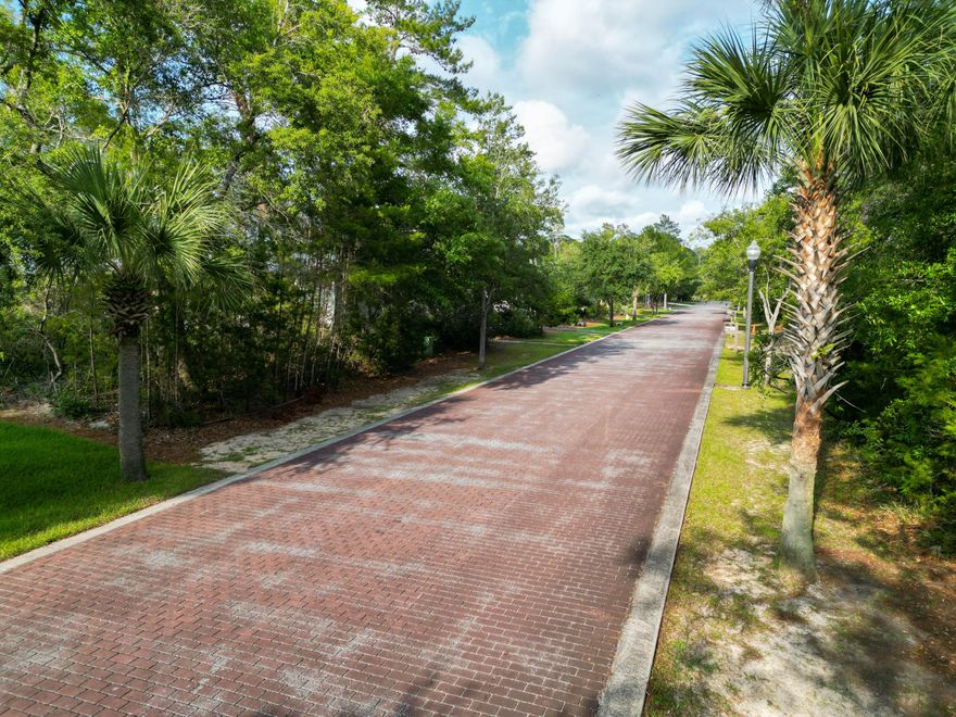 A quiet residential pocket of Santa Rosa Beach gives you a stable canvas for a custom home. Defined by a red brick street, mature trees, and the rare advantage of a true no flood zone. The setting has a natural continuity that supports a refined layout, steady light, and long-term calm with no short term rentals disrupting the rhythm of the neighborhood. The lot's shape and canopy allow a clean architectural line, a private outdoor living core, and a build that feels rooted rather than imposed. Proximity to 30A and the beaches adds function without sacrificing the quiet that defines the area.