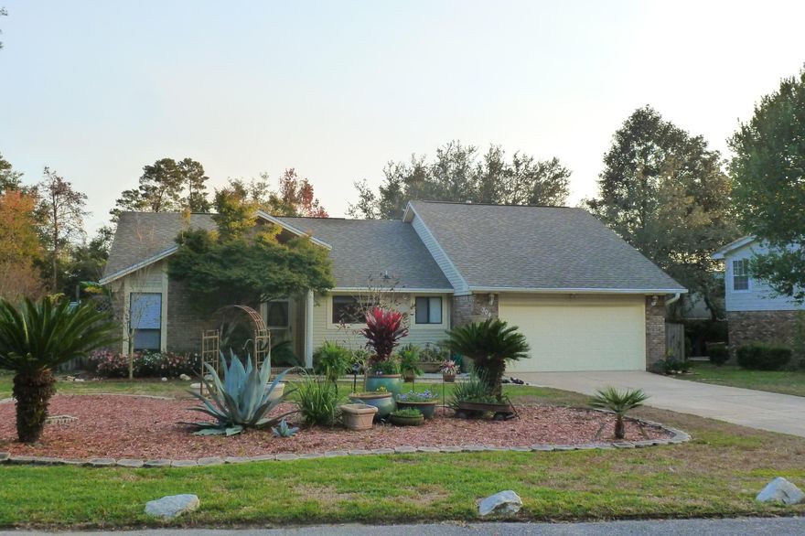 Pride of ownership shows in this 3 bedroom 2 bath brick home on a .34 acre lot! Fall in love with your backyard oasis! Impeccably maintained large gunite pool and spacious patio/deck are enclosed in the lanai and there is still a huge backyard! New roof in 2003! Kitchen is open to the spacious living area with wood floors and a cozy fireplace. The Florida room has custom tile and offers a flex space for a second living area, office, and/or playroom. There is a split floor plan with a spacious master suite with 2 closets. New wood flooring in hall and one bedroom as well. Termite bond in place for peace of mind. Pool enclosure was redone in 2010, pool/deck resurfaced in 2009, new pool pump/filter in 2013, new irrigation pump in 2009. This home must be seen in person to appreciate!