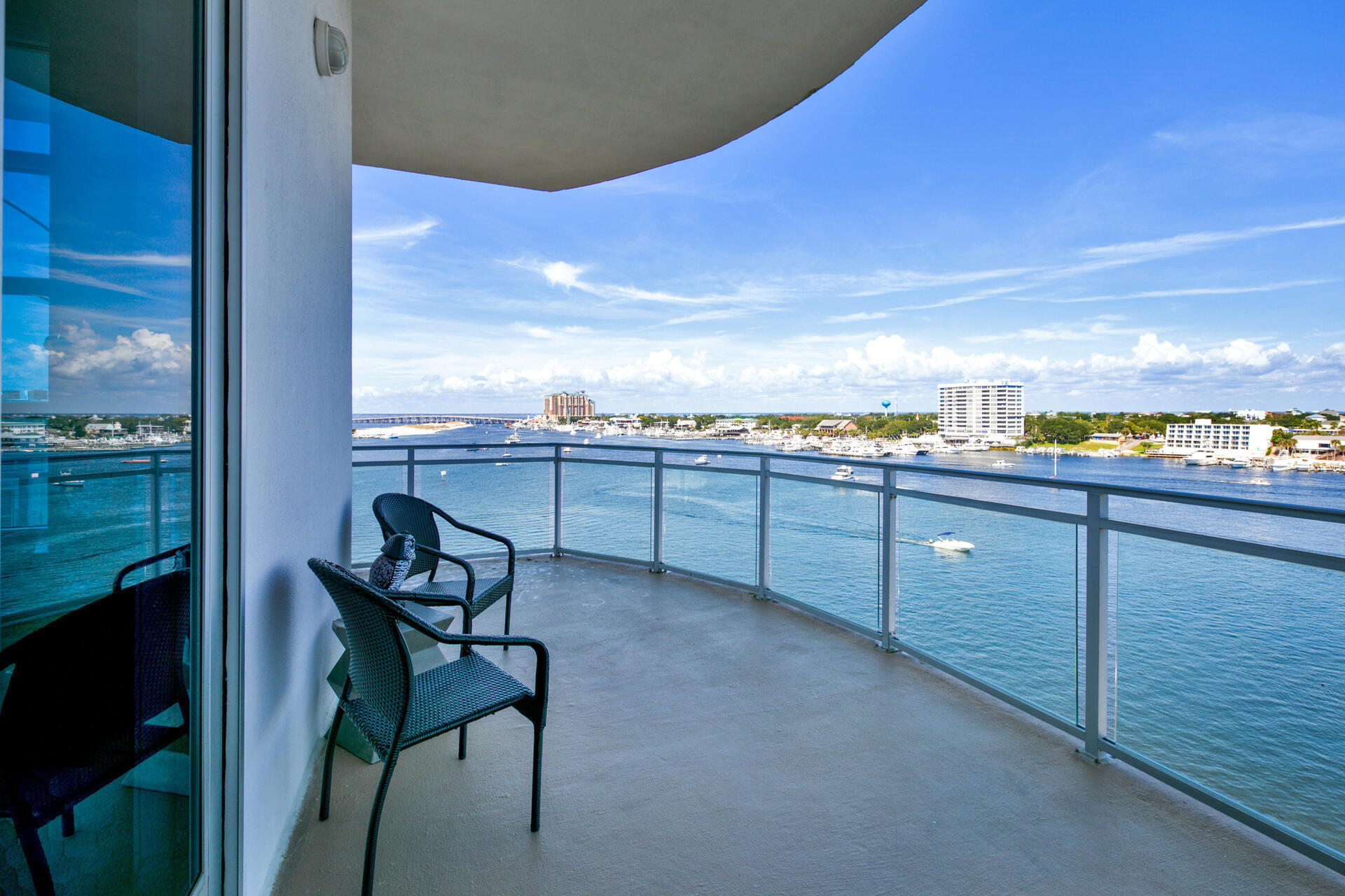 STUNNING Views from every room in this 3BR/3.5BA PENTHOUSE with bunkroom. The 1,191 SF wrap around balcony features incredible views of the Gulf, Pass, Harbor & Bay. The open concept floor plan is perfect for owners who love to entertain friends and family. This penthouse also features 12FT ceilings, oversized custom doors, porcelain tile, granite countertops , custom wood cabinets & oversized crown molding. Upon entering this stunning penthouse, you will be greeted with a $75,000 smart home system. This condo also features two master suites, the largest storage unit in the complex, 2 private garages and last but NOT least a 50x22 Boat Slip and boat lift. Harbor Lights has gated access, pool, hot tub, gym, dog park and deeded beach access. Call me! This one will not last!!
