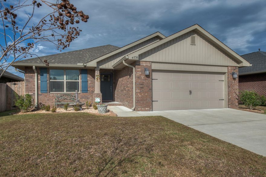 Built in 2018, this 3/2 home in Pace is a new homeowner's dream! Immaculately maintained interior, gorgeous new wood plank flooring, plantation shutters, an in-home security system and gutters around the perimeter can all be found here. The master bathroom has a spacious walk-in shower and the master bedroom is large enough to create your own personal sitting space. This home also has two eating spaces: the kitchen/dining area and a formal dining space. In the backyard you will find outdoor ceiling fans, a covered patio and plenty of space to entertain or raise a family. Located near all of the major shopping and dining and a short drive to the local schools, this property is in the perfect location for any prospective buyers.