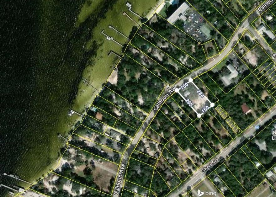 1 Acre on Calhoun, zoning is CMU-V Buyer to confirm land use with the City, can possibly be subdivided into 2 or 3 residential lots. or utilize for your personal estate home.