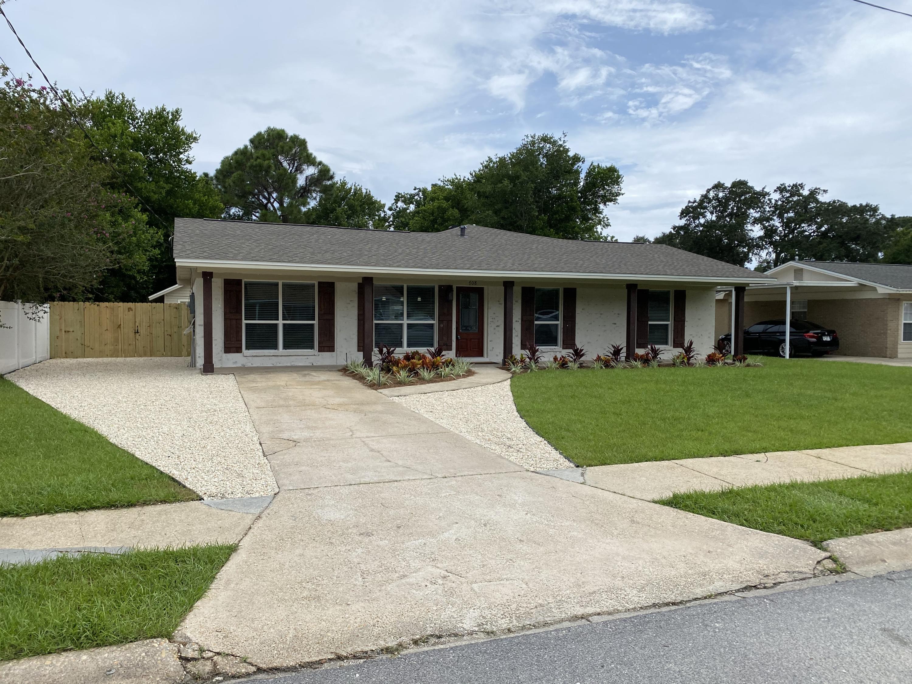 This beautiful remodeled 3 bedroom 2 bath home is in a very desirable neighborhood. Closed to schools, shopping, Hurlburt Field military base and beaches. The updated style is evident the minute you walk through the new front door and see the all new wood looking tile floors in the two living areas and brand new carpet in the bedrooms. All new paint throughout, gorgeous new light fixtures and plumbing fixtures. The kitchen has new cabinets with soft close doors and drawers, granite counter tops and all new appliances. The baths look elegant with new vanities and granite countertops. New custom tile in the master shower add a touch of luxury.The exterior has german smear finish brick, new roof and AC. New landscaping and privacy fence highlight the great yard. It is a must see!