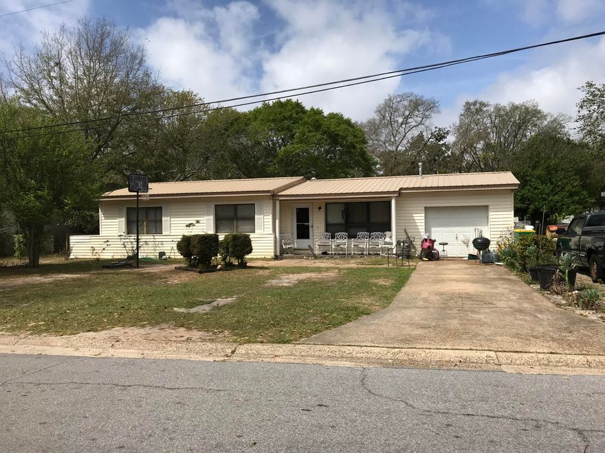 Investors check out this 4 bedroom 2 bath home that is centrally located and close to Eglin AFB and Hurlburt Air Force Base!  LARGE BACK YARD is a plus for backyard activities; There is a great park across the street to enjoy! Great rental opportunity; Metal roof 2013; new carpet 2016; NEW HVAC 2021 and new duct work in 2019!