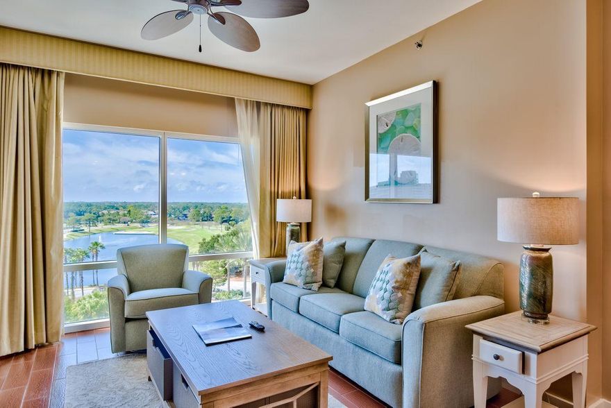 Sixth floor west-facing - Prime Location in Luau II .New furnishings and coastal decor make this now an A rated unit on the rental program. Relax and enjoy the breathtaking views of the lagoon pool, golf course, lake and gulf from the large private balcony. Nicely upgraded with easy maintenance porcelain wood plank tile throughout, the open layout of the living/dining area includes a full-sized sleeper sofa to accommodate extra guests. The master bedroom is complete with a king size bed and en suite bath.