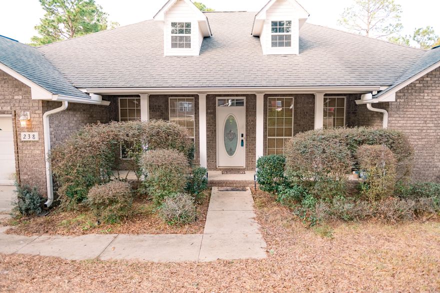 This stunning 4-bedroom, 3-bathroom home seamlessly blends modern amenities with classic charm, offering a perfect space for comfortable living. With three full bathrooms, including two ensuite options, you'll never have to share personal space again. The home features generous closet storage, a convenient laundry room, and a pantry for all your organizational needs. The spacious family room is ideal for movie nights, game days, or simply relaxing by the fireplace. At the heart of the home, the kitchen will impress any chef, equipped with stainless steel appliances, ample counter space, a large island, and an eat-in dining area. The formal dining room is perfect for hosting dinner parties and special gatherings.For added convenience, the 2-car attached garage provides protection for your vehicles and additional storage space. Outside, a large backyard awaits, offering endless possibilities for outdoor entertainment and recreation. A privacy fence ensures a peaceful and secure environment for your family to enjoy. Relax on the front porch with your morning coffee, or take advantage of the covered patio for grilling and alfresco dining.

Located just minutes from schools, parks, shopping, and dining, and south of I-10, this home is ideally positioned for easy access to military bases and commuter routes. Don't miss the opportunity to own this exceptional property that offers a perfect blend of comfort, style, and outdoor living. Call today to schedule a private showing or for more details.