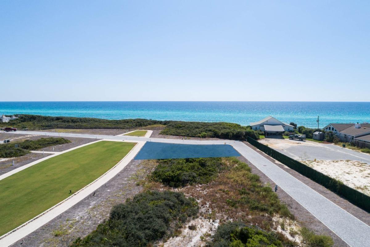 Entered for comp purposes.  Located on elliptical Bela Gray Park just steps from the gulf of Mexico by way of the Bela Gray Beach Access.  Accommodates up to 3 story home with full roof top terrace.