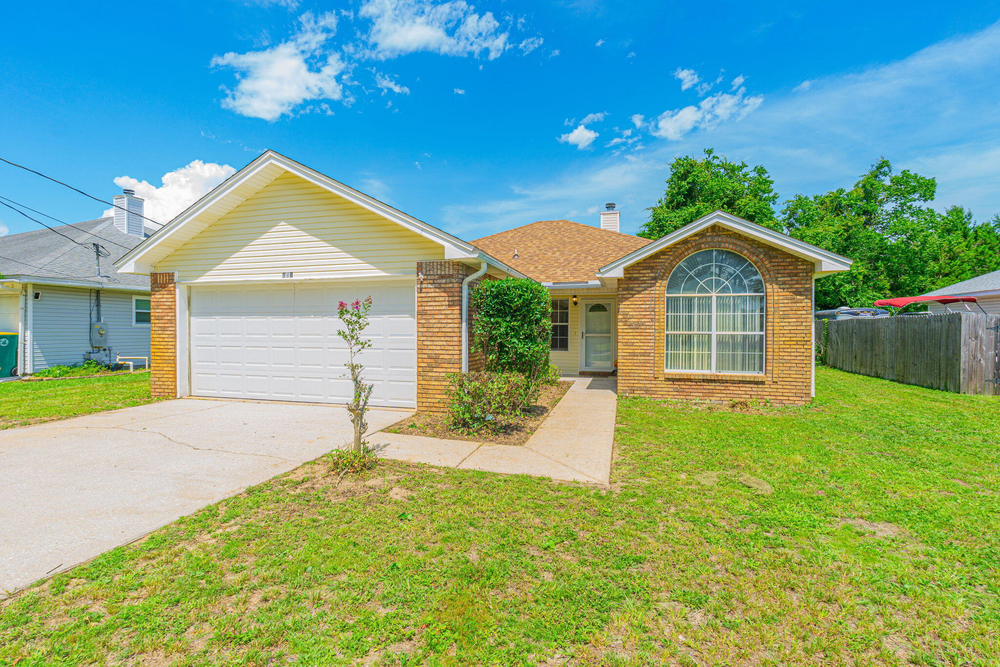 Welcome to your happy place! This adorable and cozy 3 bed, 2 bath cutie sits on a quiet dead-end street with zero HOA drama. With a large 0.31-acre fenced lot, 2023 Roof, 2-car garage, and NO carpet - it's got the charm and location, at a price that can't be beat! Inside, enjoy fresh vibes with brand-new LVP flooring, a full interior repaint, and a new over-the-stove microwave joining the newer stainless steel fridge, stove, and dishwasher. You're just seconds away from shopping & dining; only 6 miles to Hurlburt Field AFB, and less than 10 minutes to the sugar white sands of Navarre Beach. Don't miss this one!