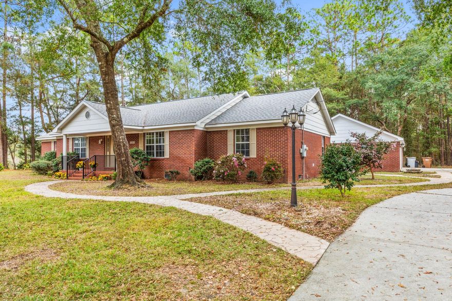 Welcome home to this beautiful 4/2 SOLID BRICK home at the end of a CUL-DE-SAC located in the quiet Tall Timbers Estates. Extremely convenient to shopping, downtown, military bases, I-10, and more, this home has been improved with a NEW ROOF, NEW WATER HEATER, NEW APPLIANCES, AND FRESH PAINT. Did I mention yet that it has a detached oversized 4-CAR GARAGE that is big enough to be a workshop dream (Seriously, you need to see this) and plenty of parking for boats, RV's, toys, etc? Or you could convert it into a huge workout room, AirB&B Studio, game room, etc. The possibilities are endless! Oh yeah, it also has TWO living rooms.. or you can convert the second one for the kids, a study, an office, or anything else: Make it your own!This property sits on a 1-acre lot and has mature trees, a