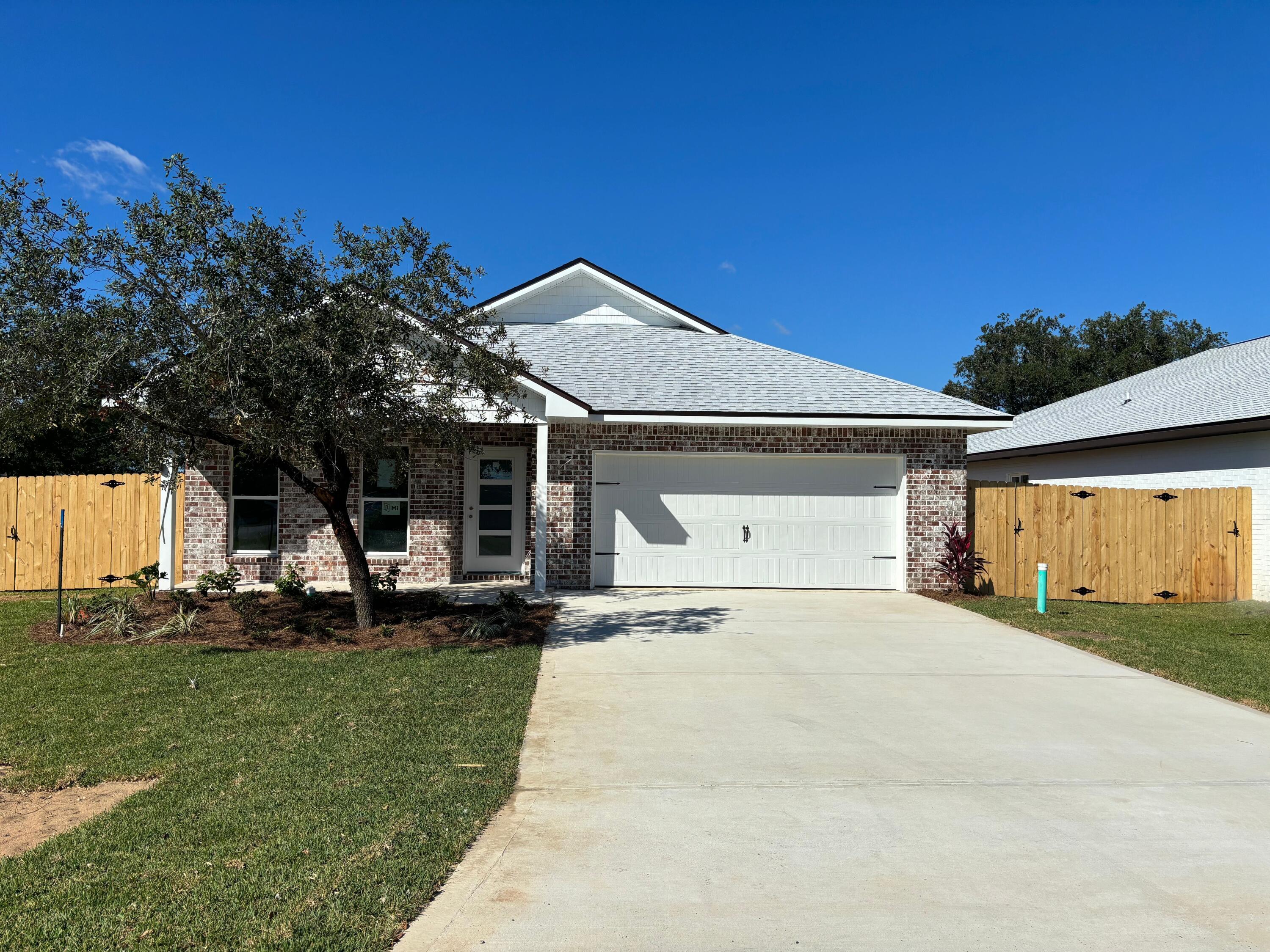 Seller offering to pay up to $10,000 in buyer closing costs. New construction in the heart of Shalimar. This 4BR/3BA, 2CG custom brick homesite has 9 Ft. ceilings w/ impressive crown molding, LVP flooring throughout most of the home, tile in the master bath, and 5 1/4'' baseboard throughout. Kitchen boasts custom painted white cabinetry, granite countertops, a large pantry, and stainless appliances. Master suite is in the right rear of the home, is very roomy, has 2 large walk - in closets, a marble walk - in shower with glass enclosure, a whirlpool garden tub and double vanity. The great room is located at the left of the kitchen. The breakfast area is at the front of the kitchen and opens to a covered porch, which is perfect for entertaining. The yard will be beautifully landscaped, will have a a privacy fence, and comes complete w/ a sprinkler system, well and timer. Insurance will be very reasonable, as home is built to today's code. Fabric Shield hurricane protection is included for the owner's piece of mind. Completion is expected in late October of 2023