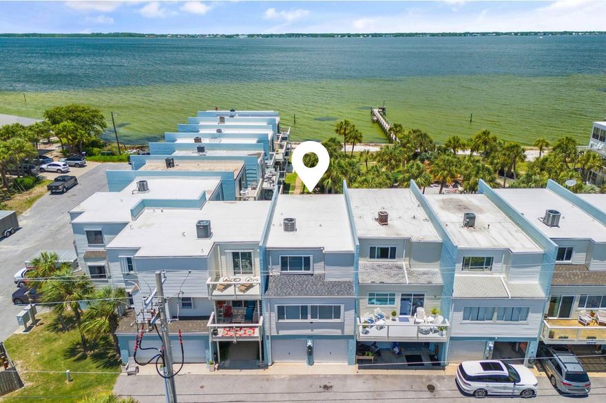 Prominently positioned to showcase the stunning views of the bay throughout the unit, this stunning coastal retreat spans three distinct levels totaling 1,900 square feet. Upon initial entry, you're welcomed into into a spacious mother- in-law suite, currently configured as an art-studio, featuring sweeping views of Pensacola Bay, custom storage with beverage fridge, and smooth shiplap accented walls. Upstairs, the main living and dining area offer stunning views of the surrounding topography and features a thoughtfully designed coastal color palette, tall ceilings, and beautiful tile flooring. A bayfront balcony beckons for outdoor gatherings, the perfect place to indulge in a morning cup of coffee, lunch or dinner, while taking in the ocean breezes and idyllic bay views. The fully renovated kitchen is equipped a luxury caf?? appliance suite, stunning quartz countertops coupled with a stunning coastal backsplash, warm wood tones and new fixtures. A guest suite, accessorized with two twin beds, desk and private-ensuite complete the 2nd level.

Ascending to the third level, the spacious, bay-facing primary suite is a true oasis, flooded with natural light and a private terrace expanding the full width of the unit, ideal for taking in the renowned hues of the Emerald Coast sunrise and sunsets. The spa-like ensuite features dual vanities with modern fixtures, white ship-lap walls, and a private water closet with bath. Just down the hall, the guest suite offers a queen size bed, views overlooking the surrounding greenery, and a private bath.

This rare, bay-front unit has been immaculately maintained and features tons of premium upgrades to include a newer HVAC (2020), Roof (2021), tankless water heater (2020), newly painted exterior, newly remodeled kitchen with all new appliances, newly painted interior, accent walls, cabinetry, and much more.


The low-density community of Bahia Paz townhomes is tucked away in the heart of Pensacola Beach and is located just a short 2-minute walk to the renowned Emerald Coast beaches. Guests and owners can enjoy stunning green spaces, a beautiful community pool and private bay-front dock, perfect for heading out on the water with a kayak or paddleboard for an afternoon adventure. Boaters will love the easy access to the Santa Rosa Sound, perfect for sunset cruises or fishing trips.

The culmination of luxury and exclusiveness creates a truly intimate setting while remaining geographically poised near all of the acclaimed dining and entertainment venues Pensacola Beach has to offer. This a true compelling opportunity for both full-time and second-home residents alike. Inquire today and start living the coastal lifestyle you deserve.


