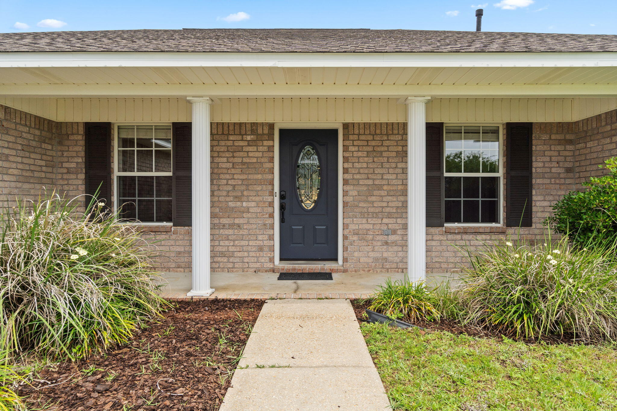Experience the best of Gulf Coast living in this beautifully updated 4-bedroom, 3-bath home just minutes from the back gate of NAS Pensacola, the sugar-white sands of Perdido Key, & a short drive to iconic Downtown Pensacola. This thoughtfully designed home features fresh upgrades throughout, including brand-new LVP flooring in all main living areas, new carpet in the bedrooms, newly painted, stylish new bathroom vanities, & updated light fixtures in nearly every room. A new roof installed in 2020 adds lasting value & peace of mind. Step into a spacious foyer that opens to a formal dining space--perfect for hosting dinners or holiday gatherings. The living area boasts vaulted ceilings, great natural light, & a gas fireplace that adds warmth & character. The kitchen is well-equipped for coo