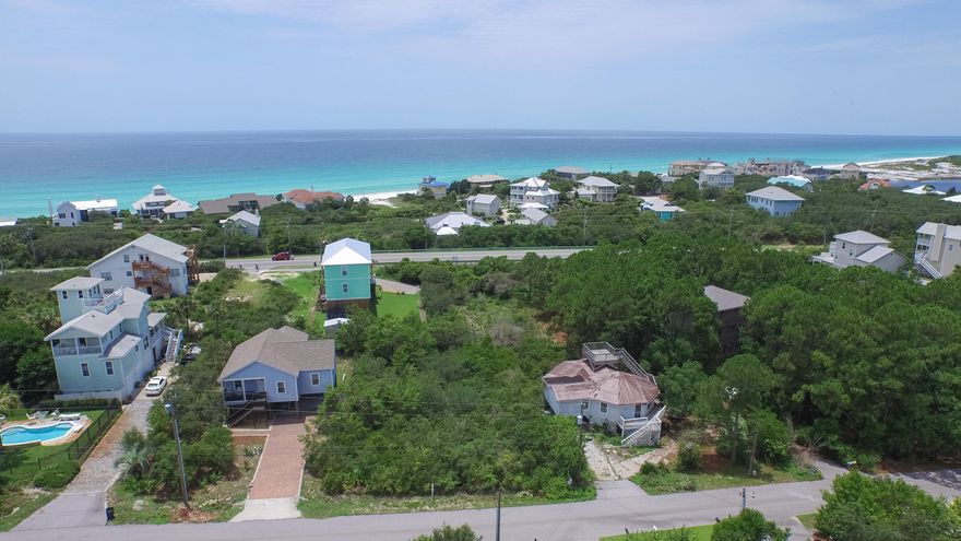 Just north of Hwy 30A, Lot 32 Baird Road offers Gulf views from 2nd and 3rd floors of your future South Walton Home. *Watch the drone video and pictures to see potential Gulf views of your dream home.* The quaint Beach Highland neighborhood offers close proximity to the BEACH (S Bishop), large lot sizes and lush native vegetation leading to the Old Florida charm. NO HOA fees or build-out time frame make this quaint neighborhood that much more desirable! Comprised of mostly full time residences, true 2nd homeowners and a hand full of vacation rentals. This area of 30A is a great spot, close to boutiques and shopping without all of the crowds! Located in Flood Zone X means lower insurance! Buyer to verify all data and information important to them