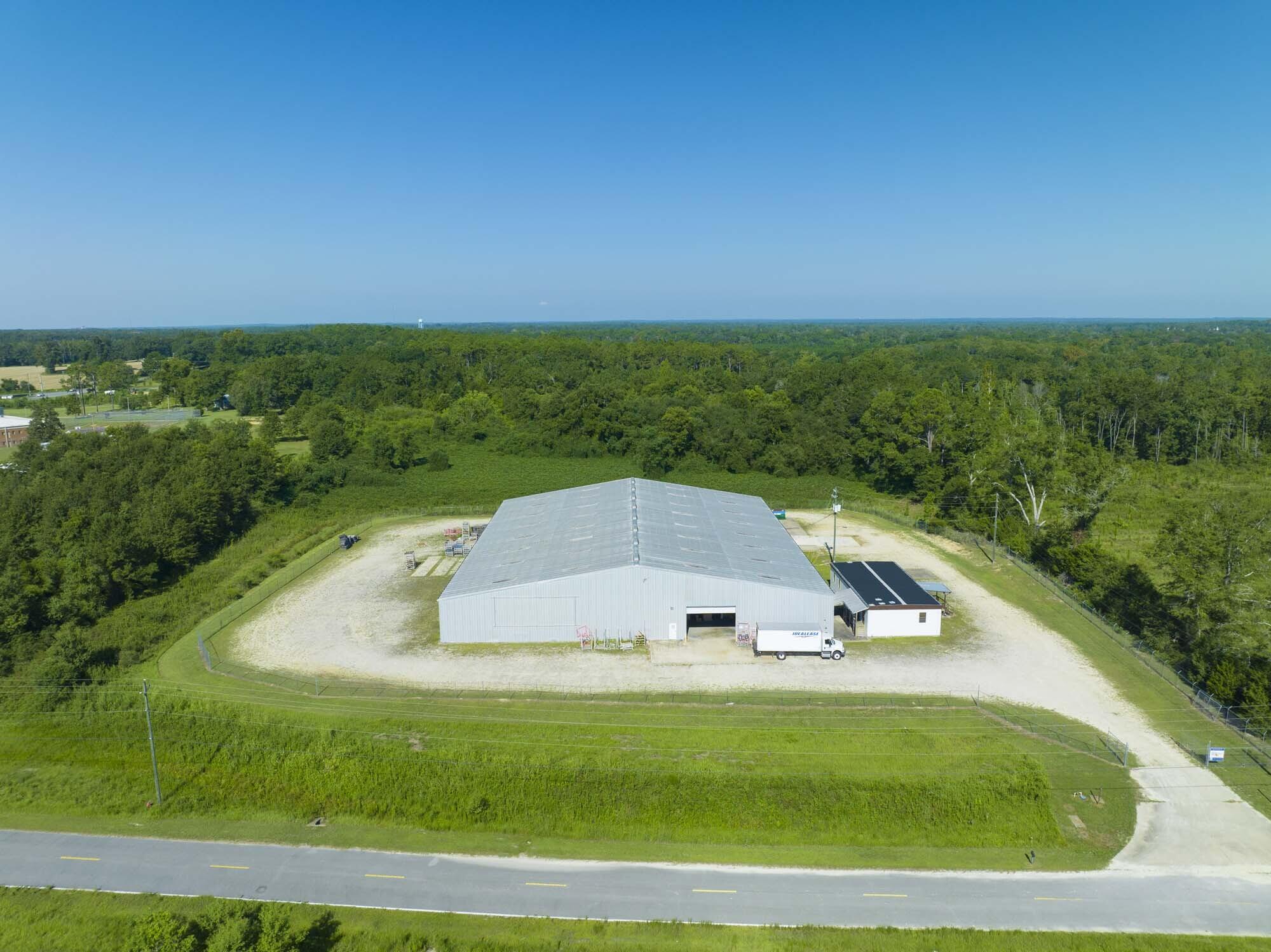Currently priced at an 8% CAP Rate on current in-place income. Located in in Washington County on 12.92 acres of land with 2 buildings, a 32,000 SF warehouse building and a 1,983 SF office space that is currently net leased to WestPointe Home, a division of Ichan Industries. The below market rate lease term runs for approx. 3 more years with no tenant options. The warehouse has 25-foot ceiling heights, 2 ground-level roll up doors, 1 loading door with 4' truck well, concrete load-stressed floors, metal roofing, and full fire suppression. The property also has 220/240V, 3 phase power and City water/sewer, in an prime area for growth. Additionally, there is adjacent unimproved and vacant land of approximately 7.2 acres to potentially construct other buildings on-site. Strategically located within the Chipley Industrial Park, and an approximate 3 mile distance to Interstate 10, this building provide optimal positioning to service Tallahassee, Pensacola, Montgomery, and Panama City MSA's. Constructed in 2005, the Chipley Warehouse includes a 1,983 SF office building built in 2007 and is in very good condition. CAP rate on current NOI is 6.42%.
This Chipley, Florida Industrial Commercial property offers a central point of accessibility, efficiency, and opportunity. With direct access to key transportation corridors and close proximity to major markets in the central panhandle area. The property at 824 Mary Helen Drive is in a logistically well positioned hub for manufacturing, storage and distribution.