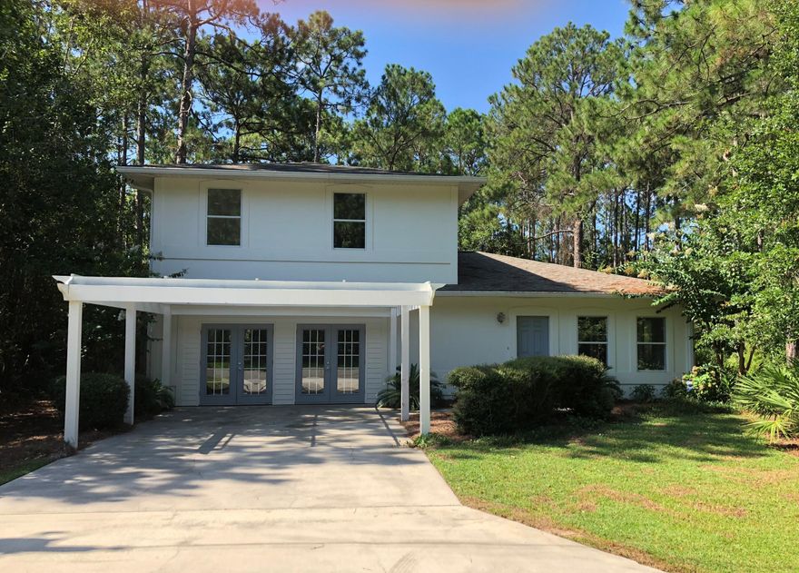 MINUTES FROM THE BEACH AND BEAUTIFULLY RENOVATED AND REMODELED!!! All new kitchen, bathrooms, appliances, flooring, heating & AC system, hot water heater, lighting, roof, gutters, down spouts, deck, interior and exterior paint plus more!! Sitting on .31 acre with a fully fenced back yard and private well. NO HOA or water/sewer bills. This home needs nothing and is move in ready. One of the sellers is a licensed Florida Realtor.