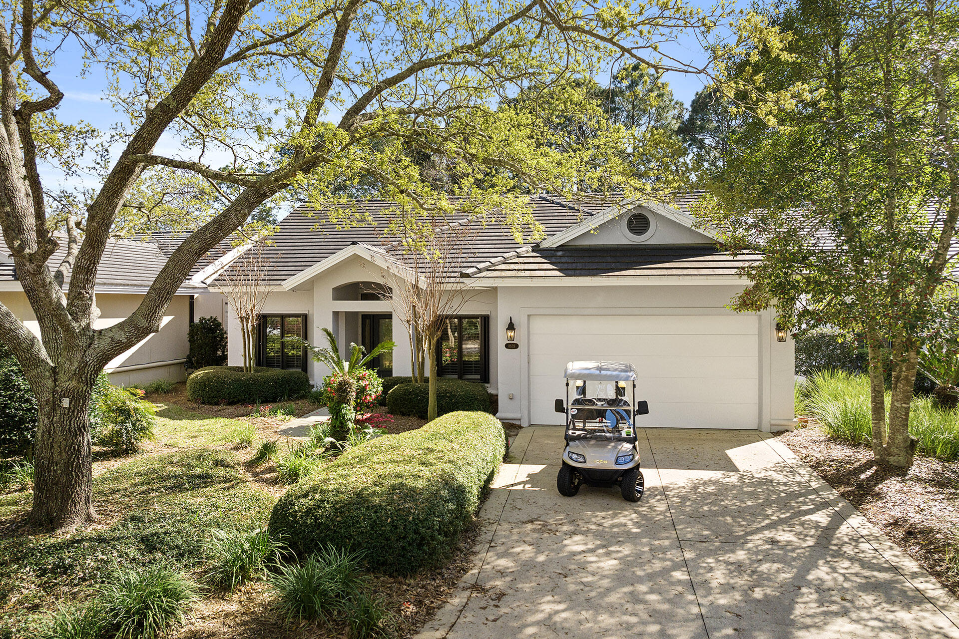 Price Reduced! This well maintained home is in the very sought after rental restricted neighborhood of St Andrews and is centrally located in Sandestin. A short walk to the Village, Marina, tennis courts, golf courses and swimming pool. The home comes with a golf cart that was purchased new in 2022 and provides you with a fun ride to shop and dine at Grand Blvd and of course to the beautiful beaches. This home was custom built for the current owners and is a nature lovers dream. The many features include a 2 car garage, an open kitchen and living area, a walk in closet in the master suite and a 7x38 screened porch with window furnishings for a rainy day. All exterior windows are fitted with hurricane shutters. This home is a great personal residence or second home.