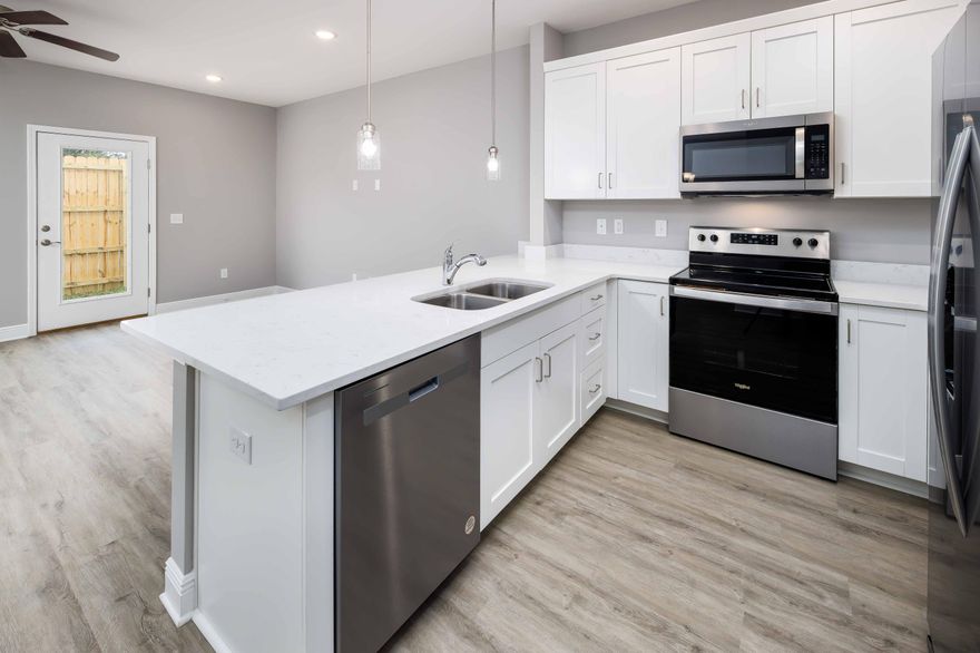 Brand NEW townhomes for sale in the heart of Fort Walton Beach! Orange Place offers 26 units in total, each with 3 bedrooms/ 2.5 bathrooms with an individual garage. This is unit 319-9, which is the fifth unit on your right. Downstairs you will find the living room, half bathroom, and a contemporary kitchen complete with Bianco Carrera Quartz countertops, soft close cabinets, and stainless steel appliances including a fingerprint resistant stainless steel side by side refrigerator. You will find LVP throughout the living and bathrooms, and plush carpet for comfort in the bedrooms. You are only a short drive away from the beaches, shopping, restaurants, Air Force Bases and more. There is an insurance quote attached for only $130.22/month. Make an appointment to come see a unit today!