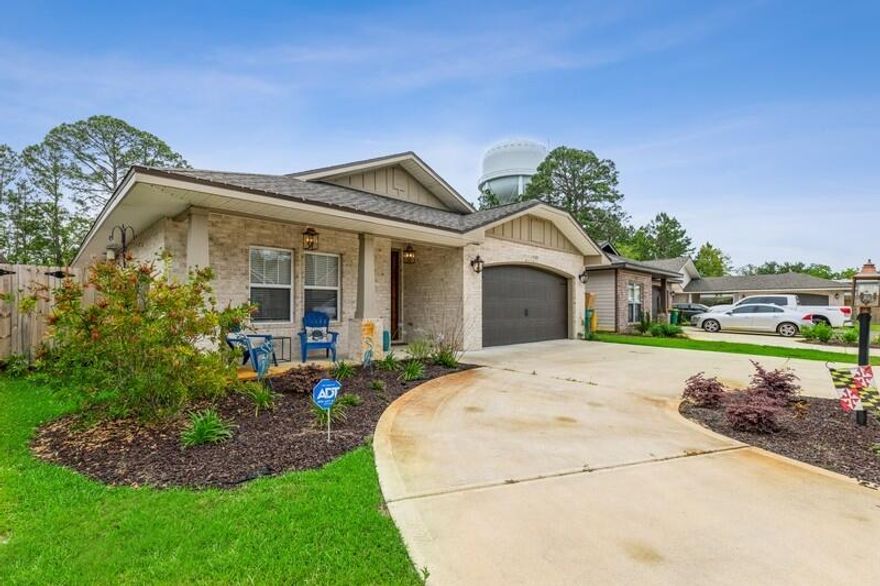 Built in 2019 this beautiful home with a circle drive is conveniently located just under 7 miles from Eglin AFB and Hurlburt Field.  At almost 2400 sq ft you'll immediately the spacious feel of this 3 bedroom/2 bath home featuring Craftsman style building, copper lantern, hardy board siding and slurried brick.  A covered porch welcomes you to an amazing open floor plan with split bedrooms.  Kitchen boasts bisque cabinetry, granite countertops,  Frigidaire Gallery series stainless appliances (including commercial grade refrigerator/freezer), spacious pantry as well as a nice size breakfast bar.   Master suite offers comfy carpet flooring and roomy bathroom with separate vanities, separate shower, garden tub and large walk-in closet.  Step outside and enjoy your grand fenced backyard