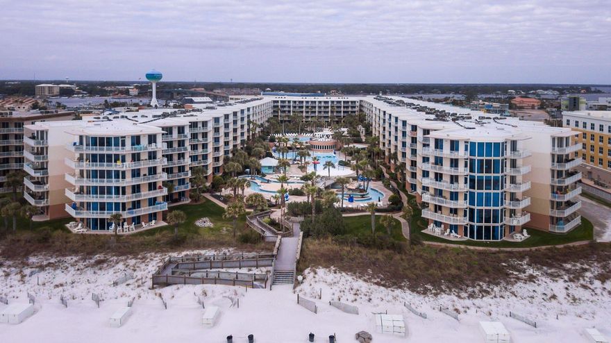 Waterscape your one stop resort directly on the gulf.  Beach style lagoon pool, lazyriver, multi water features, 2 hottubs, heated pool, toddler area, snack bar & 500' of beachfront. Unit c404 overlooks the courtyard area to Gulf. Very tastefully decorated & rental ready makes this a great opportunity to own, rent & enjoy all that Waterscape has to offer. Sleeps 10 in this2BR 2BA w/bunk area unit. Granite countertops, stainless appliances, crown molding complete the package.  The following were replace over the past few months. Refrigerator, Mattress , Polywood Patio table & chairs, all faucets, most light fixtures, both baths had new tile accents added & various furnishing replaced over this same time. The unit is tiled throughout & was repainted in '21. Seller intends to do a 1031Exchane
