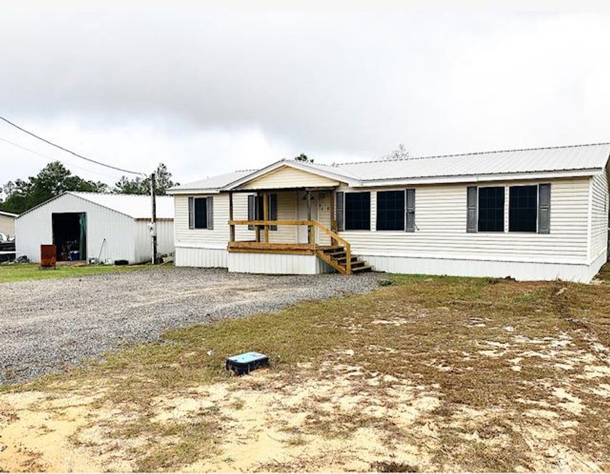 REDUCED!! MOTIVATED SELLER!!!SPACIOUS 4 bedroom, 2 bath mobile home on 2 lots which would make a total of almost 1/2 acre. In the last 2 years, the Seller has updated to new appliances, new hardwood flooring, new metal roof, added covered front and back porches, newer washer and dryer that can stay with the home, and new A/C. The septic has been cleaned out within the last year. There is LED lighting throughout the house and garage. The property is fenced in. A new SMART Home Thermostat was recently installed. There is also a detached garage/workshop.