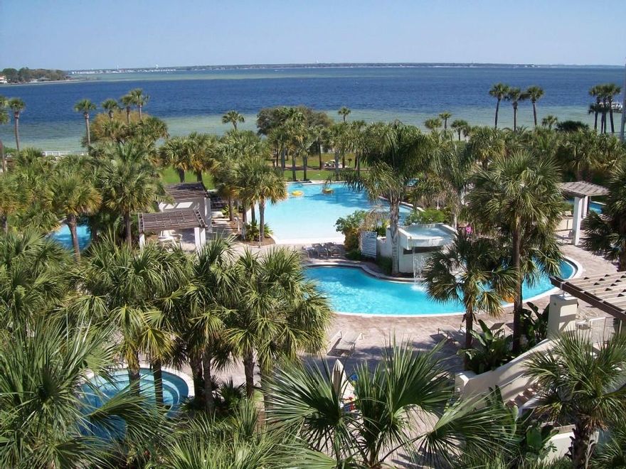 Located on beautiful Okaloosa Island, Destin West Beach & Bay Resort is one the Emerald Coast's most family-friendly vacation spots. This fifth floor unit overlooks the 700-foot lazy river and lush tropical landscaping. The unit has a spacious bedroom with an adjoining bath. A bunk room also has its own bath. The living space flows out to the tiled balcony through a wall of glass sliders. Destin West Bayside has amazing amenities: Lazy river, seasonally heated lagoon pool with waterfall, charcoal grills & picnic area, two hot tubs and lots of manicured lawn space. Walk across the skywalk to the beach and enjoy the fitness center, a 5000 square foot pool, covered heated pool, kiddy pool, and splash garden playground. Perennially, this units grosses over $40,000 in rental income.