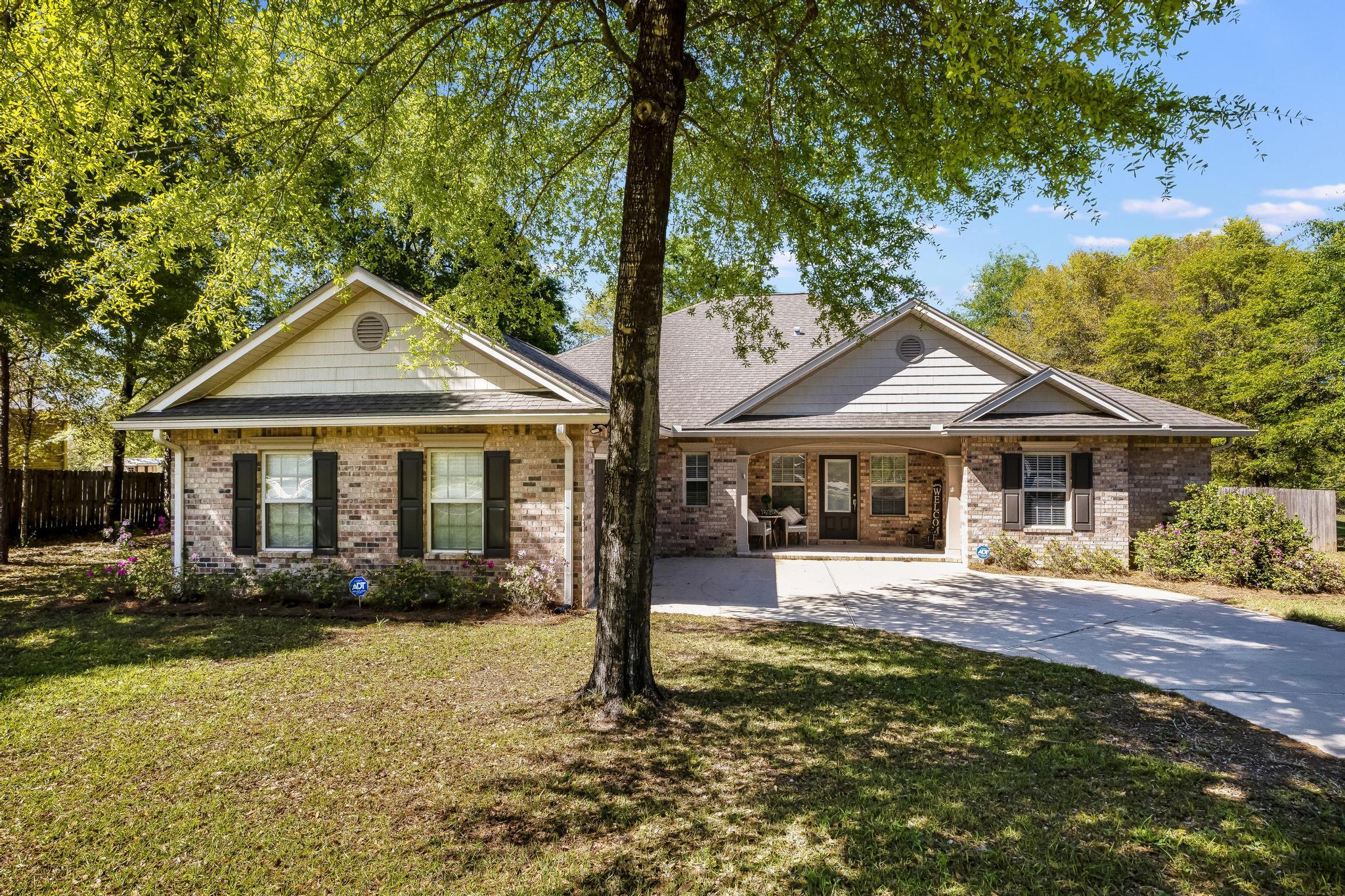 Tucked away in this quiet neighborhood is this beautiful 4 bedroom, 2.5 bath home! Stepping in to the foyer you see the open living space with upgrades that include custom shelving, crown molding, recessed lighting, and an open view of the kitchen/dining, living areas. Enjoy the wrap around breakfast bar, granite counters, tile backsplash, and tall cabinetry to fit all of your culinary needs! The split bedroom floor plan has 2 bedrooms sharing a Jack and Jill bathroom off of the kitchen, and the Master suite tucked away opposite the living room. The tiled shower, large soaker tub, separate vanities, and 2 walk-in closets make this a wonderful place to relax. Stepping out the back door you will enjoy the large, flat fenced in yard!