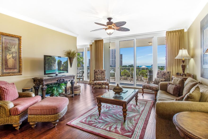 Enjoy panoramic views of The Gulf of Mexico from all rooms and the expansive private balcony of this condo located in the exclusive rental restricted building of One Beach Club Drive. This meticulously kept condo features gulf views, hard surface flooring throughout, including hand scraped engineered wood and travertine flooring. The kitchen offers granite counter tops and breakfast bar with travertine flooring. The master bedroom also offers balcony access and gulf views. The en suite master bathroom has a double vanity, whirlpool tub, and large walk-in shower. There is a guest bedroom with balcony access, full bathroom, powder room and full laundry room with sink.