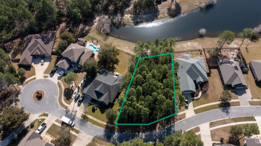 Seize the opportunity to create your custom home on a premier waterfront lot in the amenity-rich community of Hammock Bay. This is one of the remaining few vacant lots available in the heart of Hammock Bay. Hammock Bay is a distinctive planned unit development that offers homeowners resort-style amenities combined with a suburban lifestyle.The community features:Zero-entry resort-style swimming pools.An Olympic-sized swimming pool.A central clubhouse.A community general store.A local brewery.A fitness center.Basketball, tennis, and pickleball courts.Food trucks.A spacious lawn for events, complete with a large screen for movies and sports. .     
.      Scenic walking trails and wide sidewalks throughout the area
.      A bayfront clubhouse with a pier.
.	A monthly calendar filled with activities for families and retirees.

 Don't miss this rare chance to construct your dream home in Freeport's top neighborhood. 