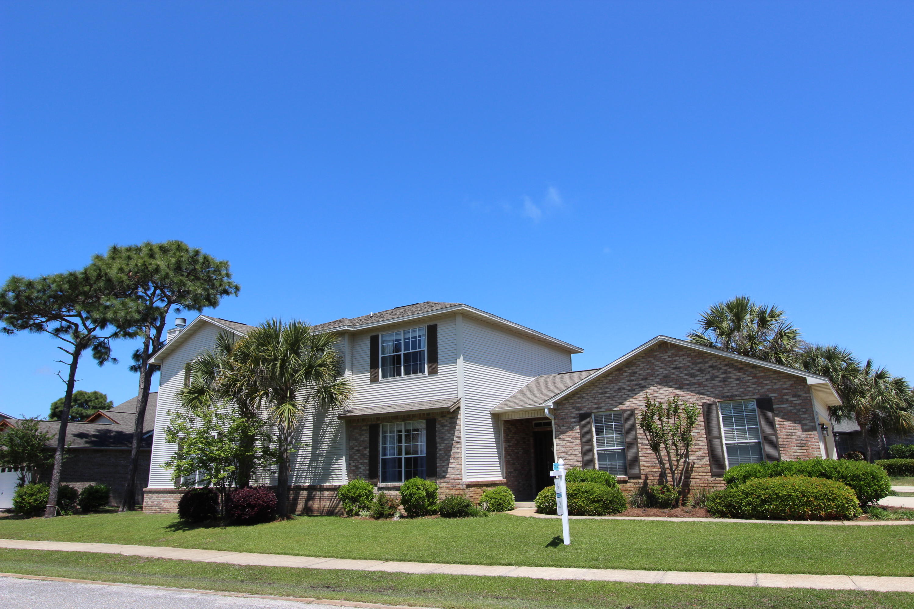 Reduced Price! Beautiful one-owner, pet free home located 2 miles from the beaches of 30a is South of US 98 in Escada. This move in ready home is situated on a nice corner lot in a quiet cul de sac and has all the upgrades! Inside features include: Large open floor plan, cathedral ceilings and fireplace in living room, in the kitchen you'll find a recently replaced stainless microwave, custom cabinetry...some with glass fronts, granite countertops, custom stone and glass back splash, and deep double kitchen sink; beautiful Santos Mahogany hardwood floors flow through the living and dining rooms, tile flooring in the kitchen, bathrooms, and spacious laundry rooms, master bedroom suite with crown molding, master bathroom with his and hers sinks, large walk-in closet, spacious guest bedrooms
