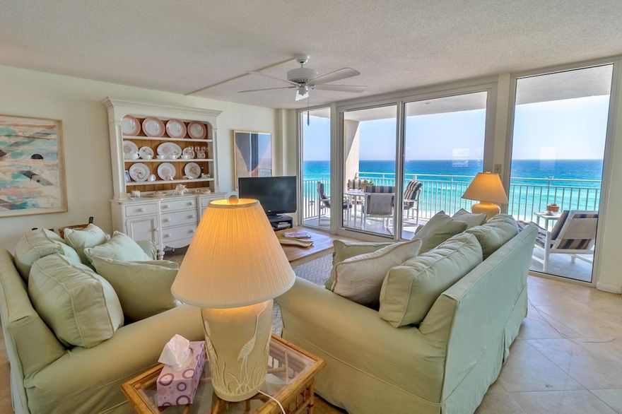 Just steps from the glorious white sand beach and Gulf of Mexico is this charming 2-BR, 2-BA, 1600sf condominium, in an exclusive gated complex. Floor to ceiling windows frame the emerald waters to the horizon with a spectacular view that can calm and thrill the spirit in every season. The inviting covered deck is perfect for dining and relaxing. Enjoy new stainless steel kitchen appliances as well as new tile floor throughout the living/dining/kitchen areas and bathrooms. A mirrored wall and breakfast bar pass-through to the kitchen, accentuate the bright and open floor plan. The master bedroom with sitting area, guest bedroom, as well as the great room, all enjoy panoramic water views. Play a game of tennis, cool off in the sparkling pool, or mingle with neighbors in the owner's lounge,