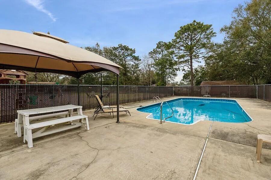 Two Homes for the Price of One! Homestead Retreat on 1.06 Acres with Pool & Guest Studio - No HOA! Welcome to your own private Florida oasis! Nestled on a sprawling 1.06-acre lot south of I-10, this charming homestead retreat offers peace, privacy, and convenience--just a short commute to Duke Field, 7th Group, Camp Rudder, and Eglin AFB or jump on I-10 and travel around the Country. The main house features 4 bedrooms and 2 baths, with fresh paint, laminate flooring, and an updated eat-in kitchen showcasing brand-new stainless-steel appliances, granite countertops, and a stylish white tile backsplash. Step outside and you'll find everything you need for a relaxed, self-sufficient lifestyle: In-ground pool with safety fencing. Fire pit perfect for cozy evenings. CONTD..... Chicken coop and a dedicated dog run or garden area for homesteading. No HOA - so bring your boats, RVs, or plans for expansion!
The studio: A covered walkway leads to a detached guest studio with attached garage, ideal for visiting family, a home office, or potential rental income. This is more than a home, it's a lifestyle. Enjoy quiet country living with modern comforts and city access just minutes away.
COMMUNITY EXPANSION AND INVESTOR ATTRACTION:
As for the Crestview community - Here's a snapshot of the exciting commercial growth and development happening in the area:
Commercial Real Estate Expansion
New Developments: Crestview is seeing a surge in commercial real estate projects, including retail centers, office spaces, and mixed-use developments. Properties like the Northcrest Shopping Center, anchored by Publix, recently sold for $7 million, highlighting investor confidence.
Prime Locations - High-traffic areas along Highway 85 and PJ Adams Parkway are hot spots for new retail and restaurant ventures. These corridors are attracting national brands and local businesses alike.
Shopping - Crestview Commons shopping center is part of a larger development plan near SR 85 and West Redstone Avenue, poised to become a central hub for retail and dining.
Dining/Restaurant Boom: New eateries are popping up, offering more variety to residents and visitors. From fast-casual chains to local favorites, the culinary scene is expanding.
Retail Opportunities: With increased foot traffic and residential growth, retail spaces are in demand. Developers are responding with new storefronts and leasing opportunities.
These projects are creating jobs, boosting local revenue, and enhancing the quality of life.
Community Appeal: As Crestview grows, it's becoming a more attractive destination for families, entrepreneurs, and investors.
