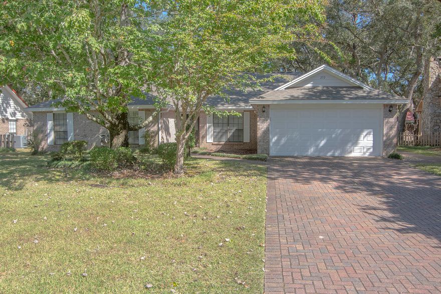 Located on desirable Dominica Circle, welcome to a renovated home with a private pool in Bluewater Bay. This brick 3-bedroom 2.5-bath home offers an additional flex room. Walking inside you are greeted by an open floor plan, a brick fireplace, and views of the backyard. The spacious master bedroom has an en suite bath with a walk-in shower and custom tilework. Comfort is key in this Bluewater Bay home. Plush new carpet in the bedrooms, luxury vinyl plank flooring throughout the main living areas, and light tile in the bathrooms. Situated on a 0.29 acre lot, mature oak trees and lush landscaping create an outdoor oasis. Enjoy a fenced-in backyard and a natural gas heated pool. Outside you have a covered patio, large paved entertaining area, and two storage sheds. Renovated in 2020, the roof and plumbing were replaced, the kitchen was renovated, along with the bathrooms, flooring, paint, vanities, lighting, and ceiling fans. Bluewater Bay in Niceville is abundant with amenities such as a marina, golf course, tennis courts, walking trails, and playgrounds. Reach out to your agent today to learn more!