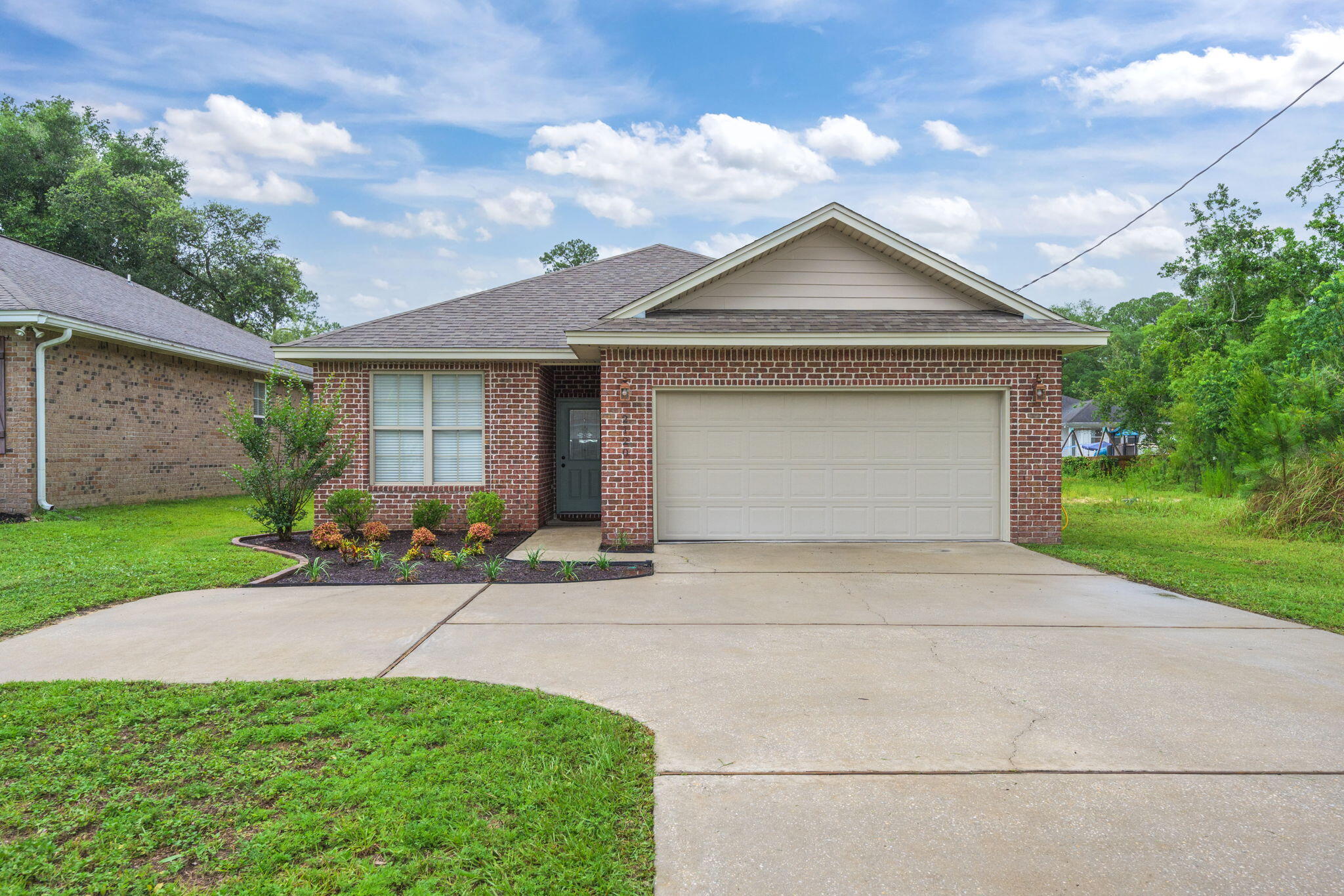 Welcome to 2120 Bayshore Drive - A beautifully maintained brick home built in 2016, located in the heart of Niceville!This 3-bedroom, 2-bathroom home offers 1,497 square feet of smartly designed living space and timeless curb appeal. Step inside to discover luxury vinyl plank and tile flooring throughout the main living areas, crown molding, and elegant recessed lighting that add a touch of sophistication.The kitchen is a chef's dream, featuring rich dark cabinetry, granite countertops, stainless steel appliances, a breakfast bar perfect for casual dining, and an open layout that flows seamlessly into the dining and living areas.The spacious primary suite includes plush carpet, a generous walk-in closet, and a well-appointed ensuite bath with dual vanities, a soaking tub, and a separate shower. Both guest bedrooms offer ample closet space and cozy carpeting.
Enjoy the Florida lifestyle in the fully fenced backyard with a covered patio - ideal for grilling, relaxing, or entertaining. A two-car garage completes the package for added convenience.
Located in a quiet and friendly neighborhood, just a short drive to top-rated schools, local parks, shopping, and Eglin AFB.
Don't miss your chance to own this move-in-ready gem in Niceville - schedule your private showing today!