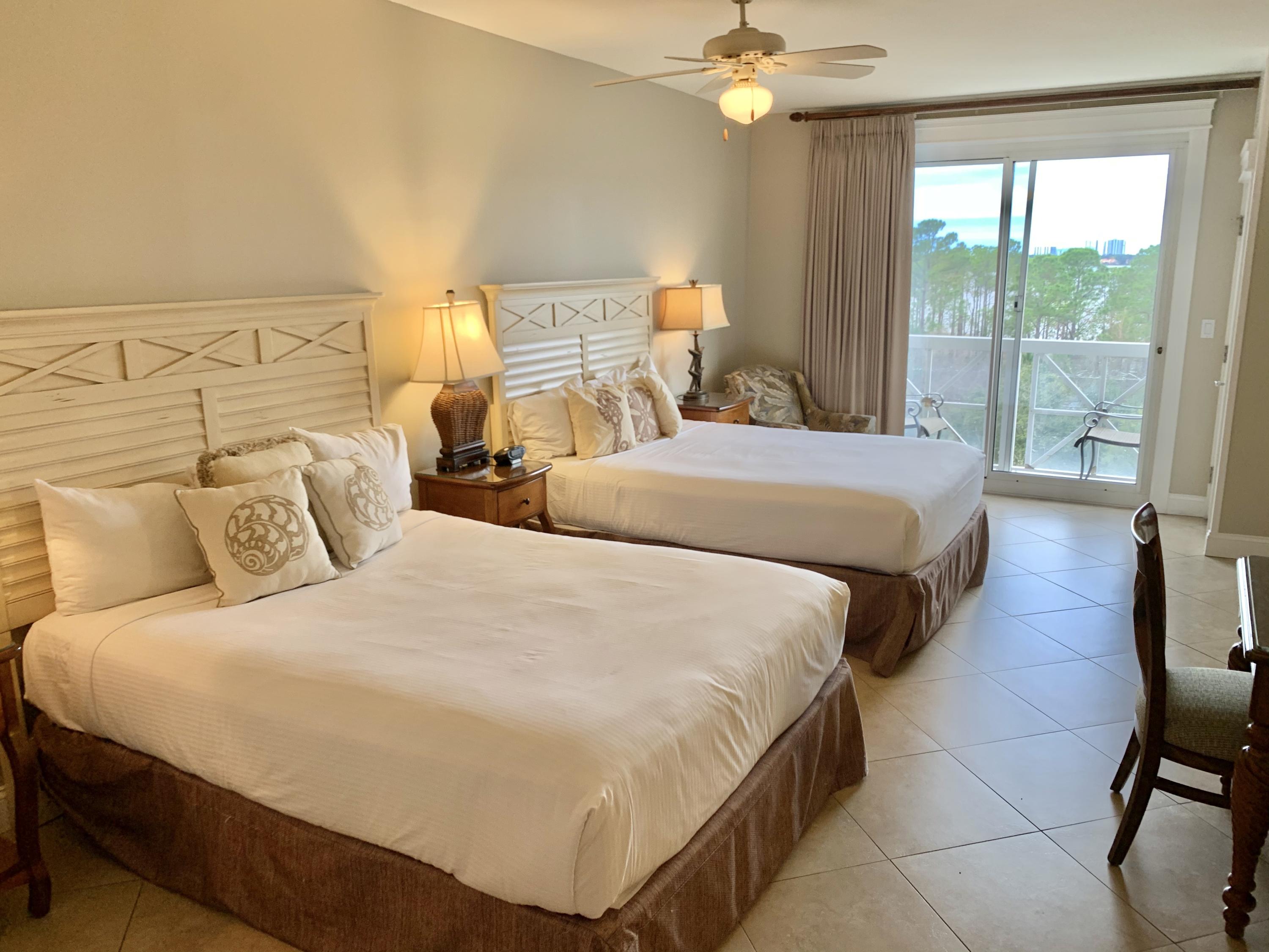 This beautiful studio has wonderful bay views and gets super rental income. It has 2 queen beds and a small kitchen too making it a popular plan.This will not only be a great get away for you and your family, but one that makes you income too. You will enjoy the bay sunsets and walking to all the activities that the Baytowne Wharf has to offer. Please call to show as it is often rented.