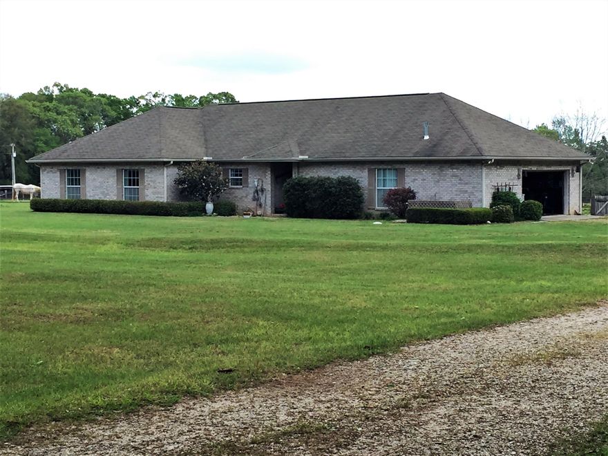 Be Prepared to be AMAZED by this Awesome Property! Perfectly Situated in Baker, FL, a town that has supported its Equestrian Community for over 20 years! Private Rural Location, Yet only a 15 Minute Drive to All the Amenities in Crestview Plus Super Close to Interstate 10. Bring your Horses, Cows, Goats, Llamas ...... This 6 Acre Property has so Much to Offer! Let's Start with the Custom 1800 Sq Ft Dream Barn that is Truly One of a Kind! Not only is it Equipped with Stalls, Paddocks, Tack Room, Electric, Water, Vehicle, Equipment & Hay Storage Areas, it can be Modified to Suit Your Personal Needs. The Entire Barn is on a Track System with Screws So You Can Customize! Don't Need a Barn .. Make it into a Workshop!! There is also a 1400 Sq Ft Detached Garage & Carport w/ Electricity that can