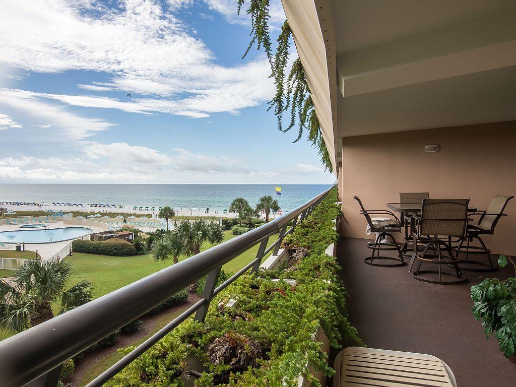 Spectacular views of the gulf & beach are highlighted in this well-maintained condo. Centrally located in the eight stack, this unit is located near the elevator & convenient to the covered parking garage as well. The updated kitchen features granite counter tops & beautiful cabinetry. Floors are 18'' neutral tile except for the bedroom which sports pretty berber carpet. The well-furnished spacious balcony, where you can relax watching the waves while sipping your favorite beverage, is easily accessible from the living area & master bedroom. Other features include an updated bathroom, full-size washer & dryer, custom draperies, & covered parking.