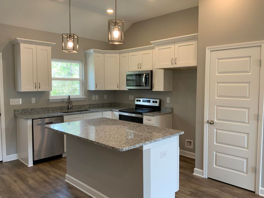 NORTHSIDE NEIGHBORHOOD IN MAJESTIC OAKS VINEYARD-ADELINE FLOOR PLAN-Quiet 1 street cul-de-sac subdivision. This floor plan is all brick construction with 2-car-garage sitting on 1/2 acre! Split bedroom plan, 10' ceilings in family/dining/kitchen area, work island in kitchen w/bar seating, pantry, shaker style cabinets, generous size laundry room, owners bath has double vanities, walk-in closet. Luxury Vinyl Plank in common areas, carpet in bedrooms. Quartz or granite countertops, stainless steel appliances. Still time for buyer to make some selections (call for details). LATE APRIL/ EARLY MAY COMPLETION.